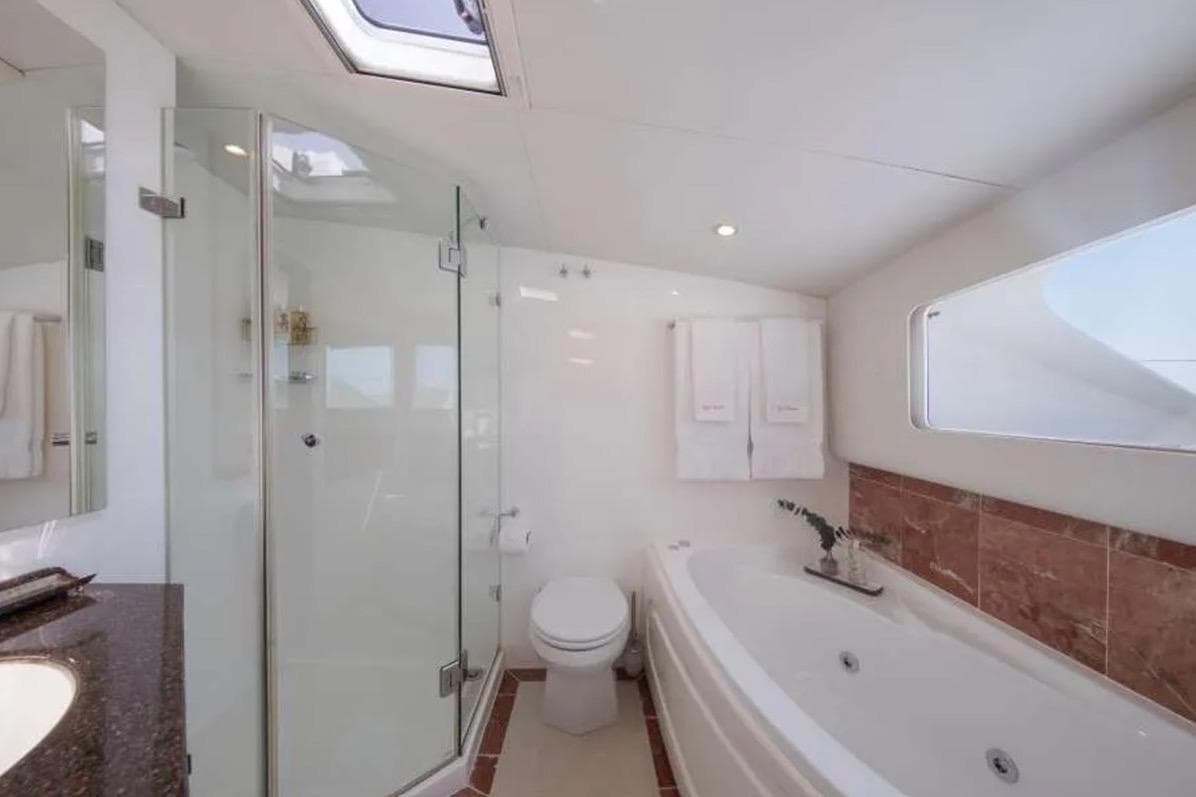 Luxurious bathroom on 2007 Matrix Yachts Silhouette 760 with shower and jacuzzi tub.
