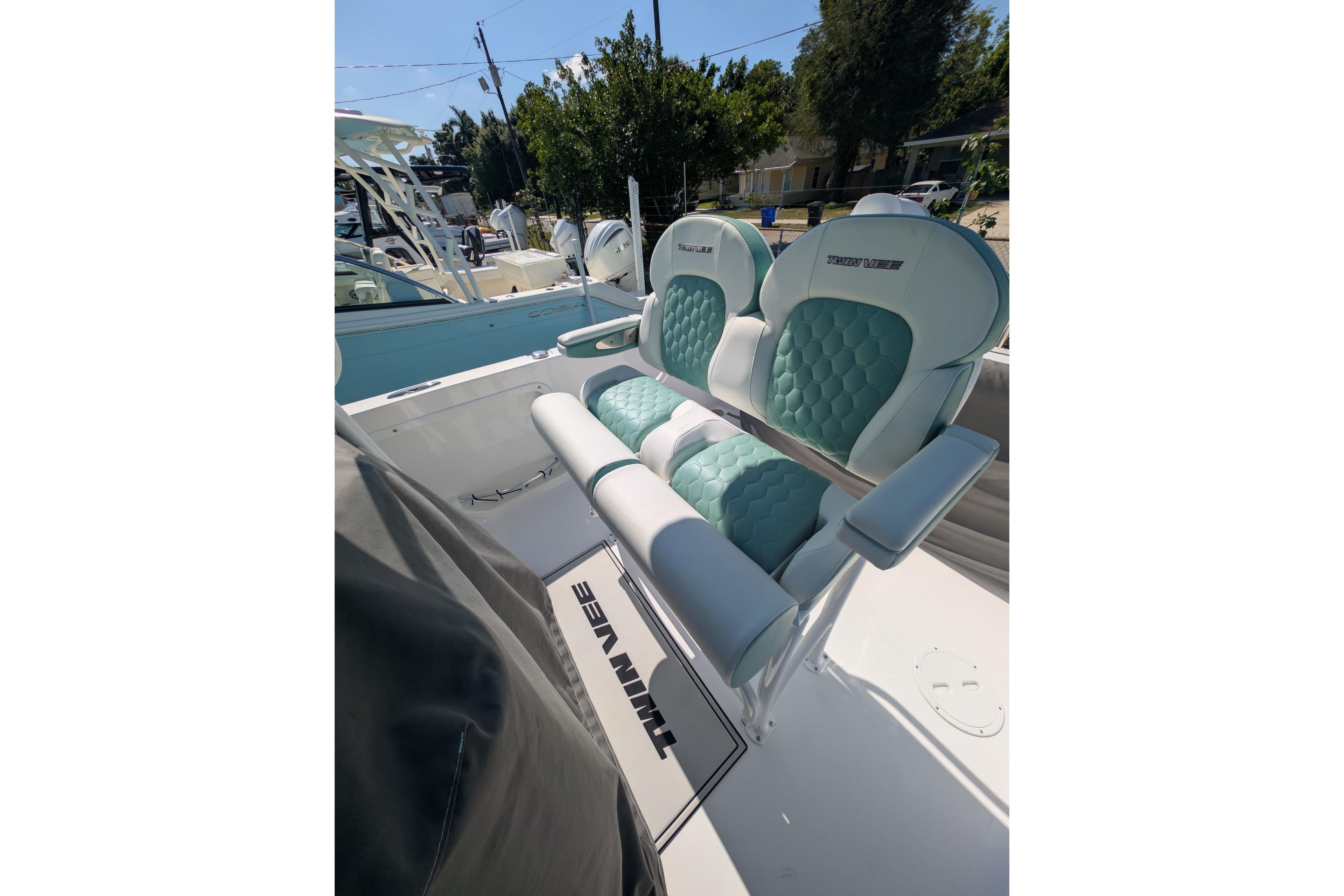 2024 Twin Vee 240 GFX CC boat seats with teal and white upholstery.
