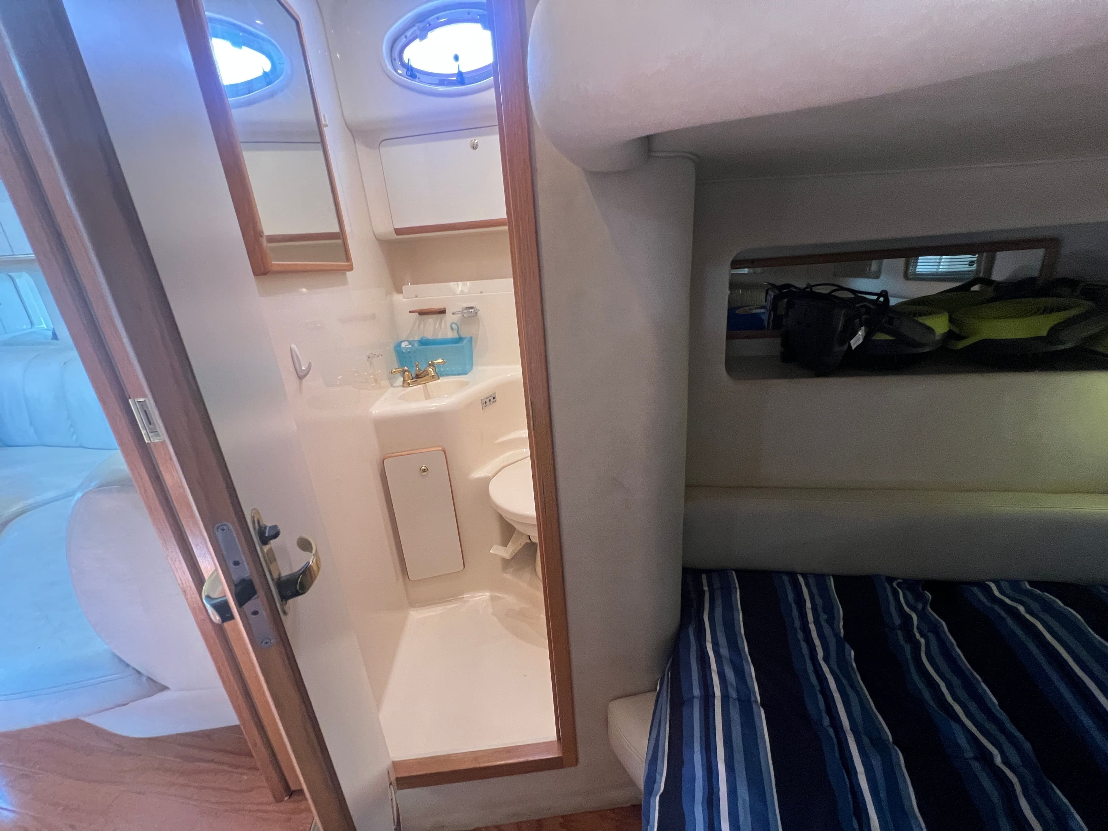 Interior of a 1997 Sea Ray 450 yacht with bathroom and sleeping area.