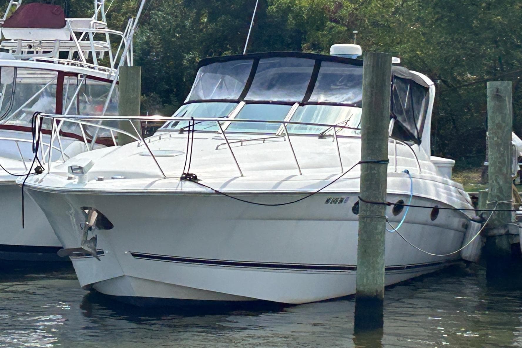 2001 Wellcraft 3700 Martinique yacht docked at marina, front view.
