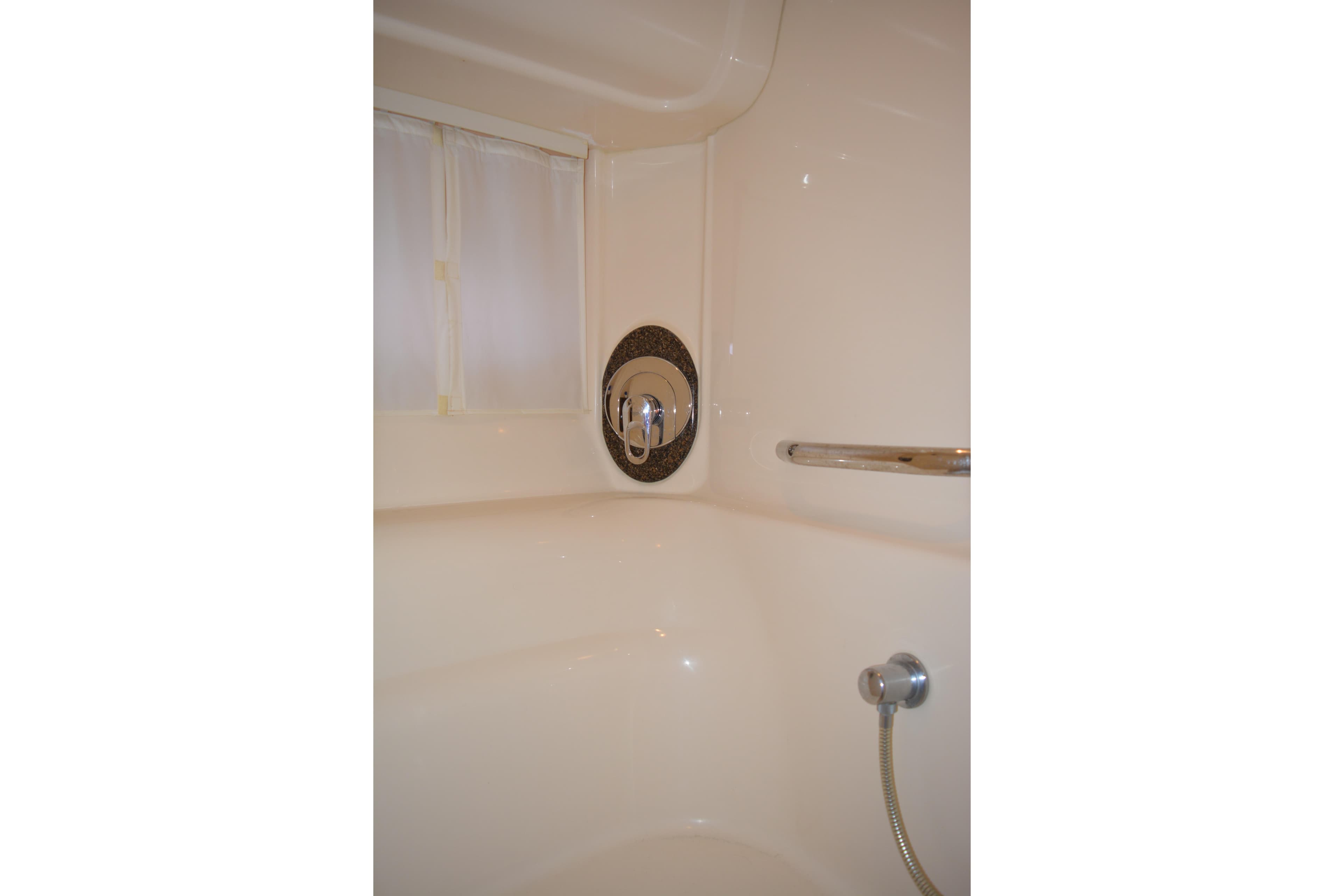 Shower area in 2007 Sea Ray 44 Sundancer yacht bathroom.