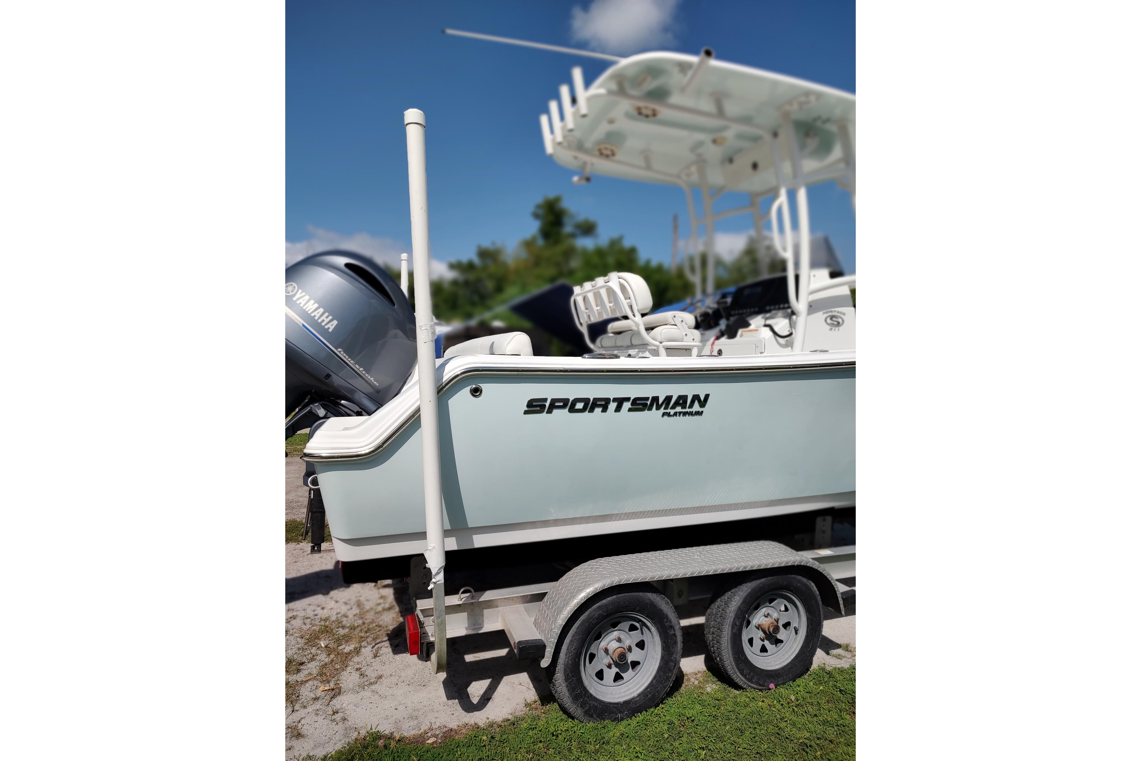 2020 Sportsman Heritage 211 Center Console boat on trailer, featuring Yamaha engine.