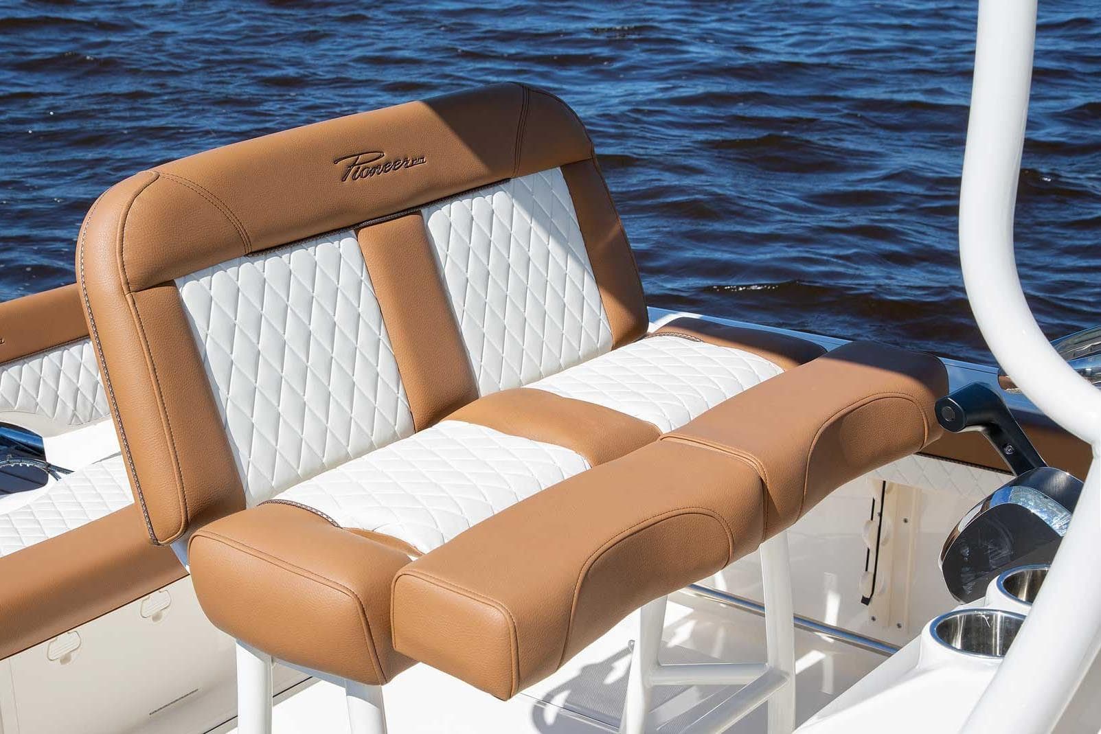 Manufacturer Provided Image: Luxurious seating on 2025 Pioneer 222 Islander boat with quilted design, near water.