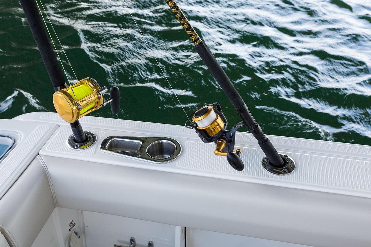 Manufacturer Provided Image: Fishing rods on 2025 Boston Whaler 230 Outrage boat, ocean backdrop.