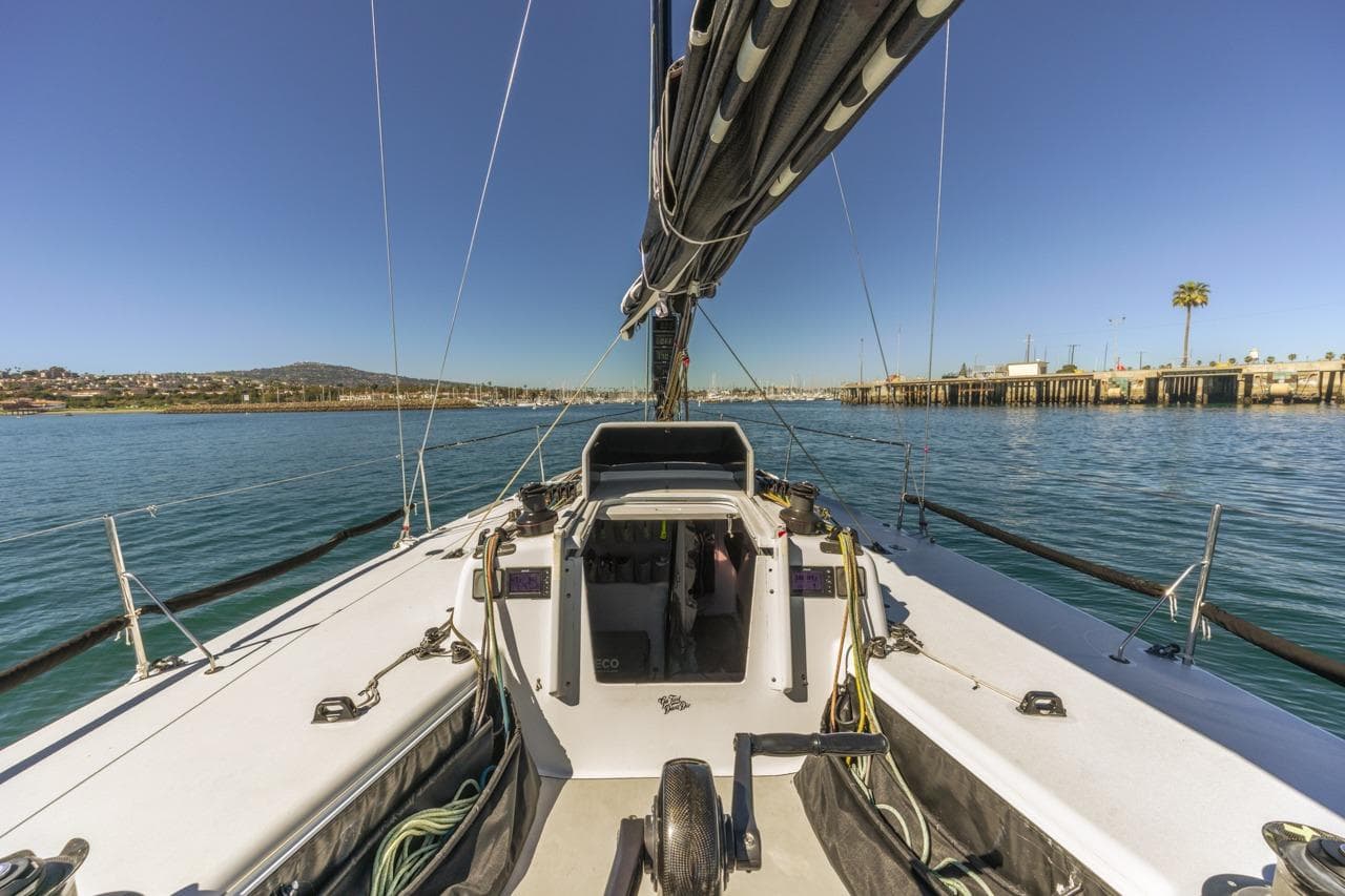 Sailboat on calm water, Rogers 46 model, 2007, with clear blue sky and coastal view.
