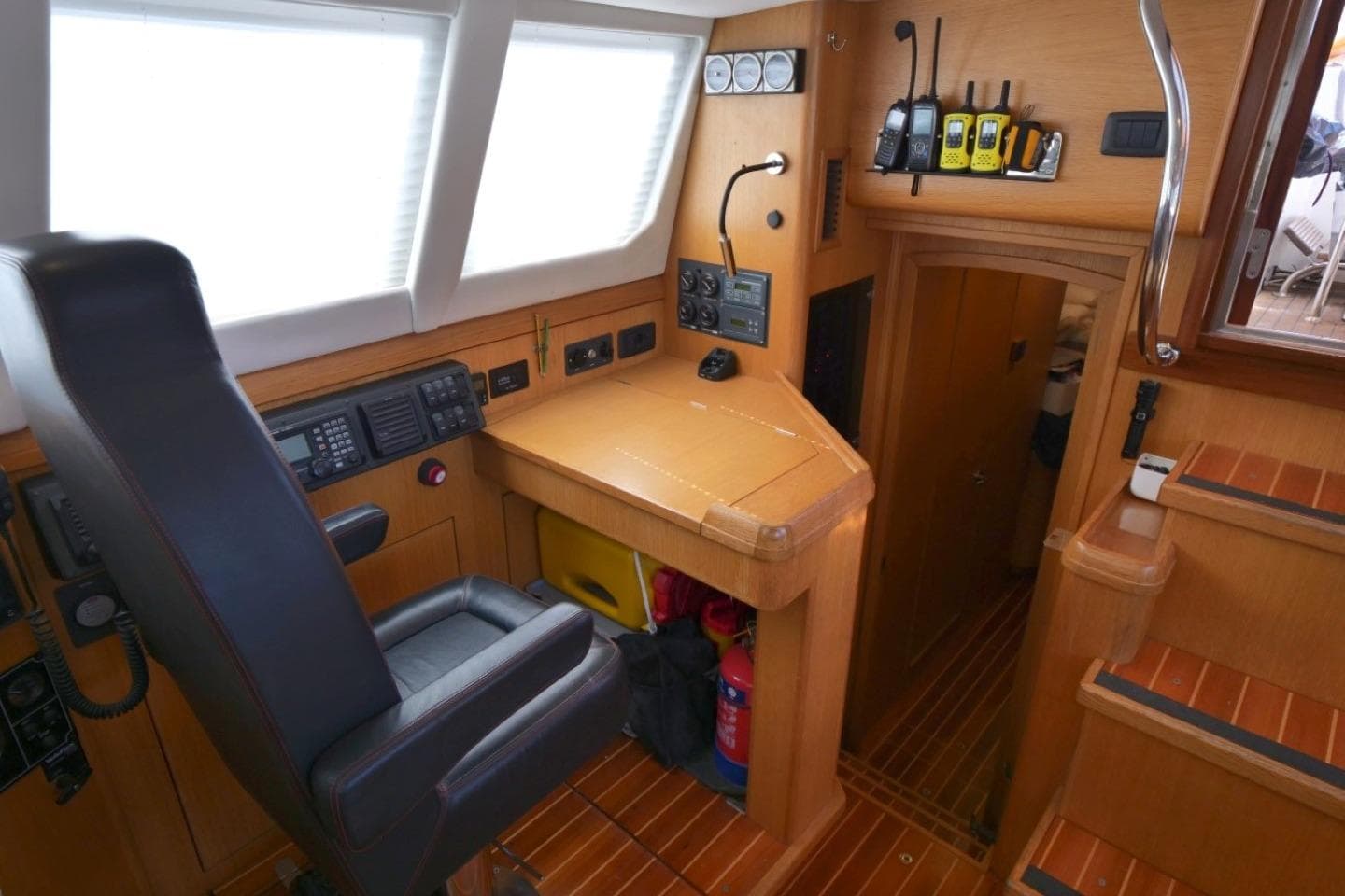 Pilot area of 2016 Bruce Roberts 16.5m Expedition Yacht with navigation equipment and seating.