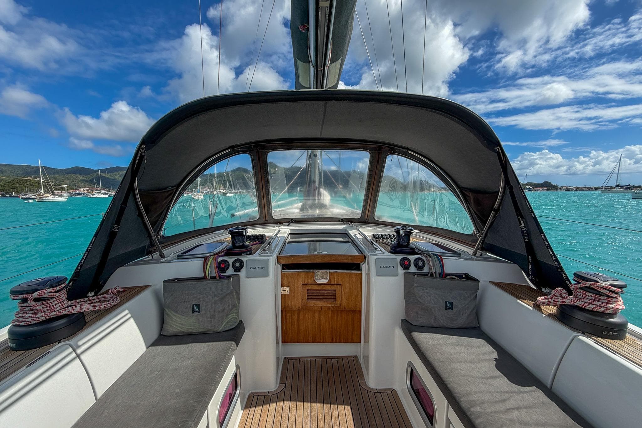 Cockpit view of 2010 Grand Soleil 46 yacht on turquoise waters under blue sky.