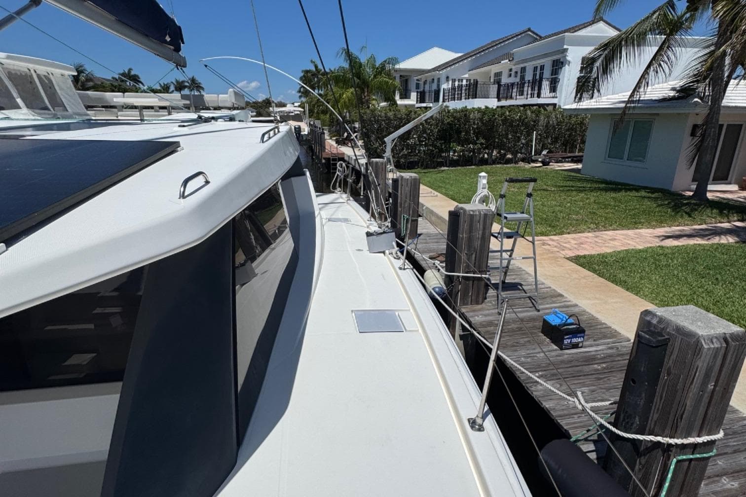 2020 Leopard 50 yacht docked at marina with clear blue sky.