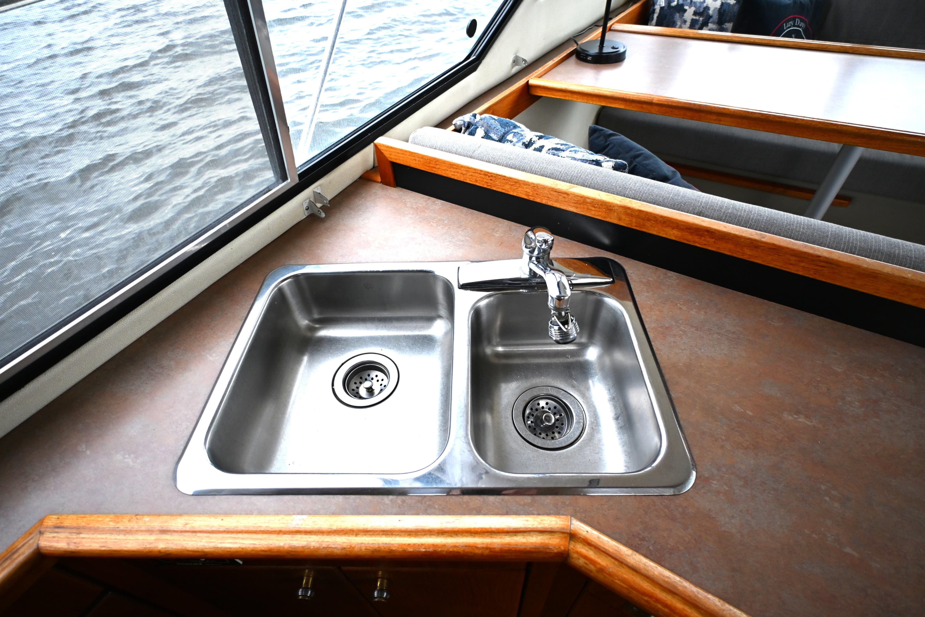 Stainless steel sink in 1996 Bayliner 4087 Aft Cabin Motoryacht kitchen area.
