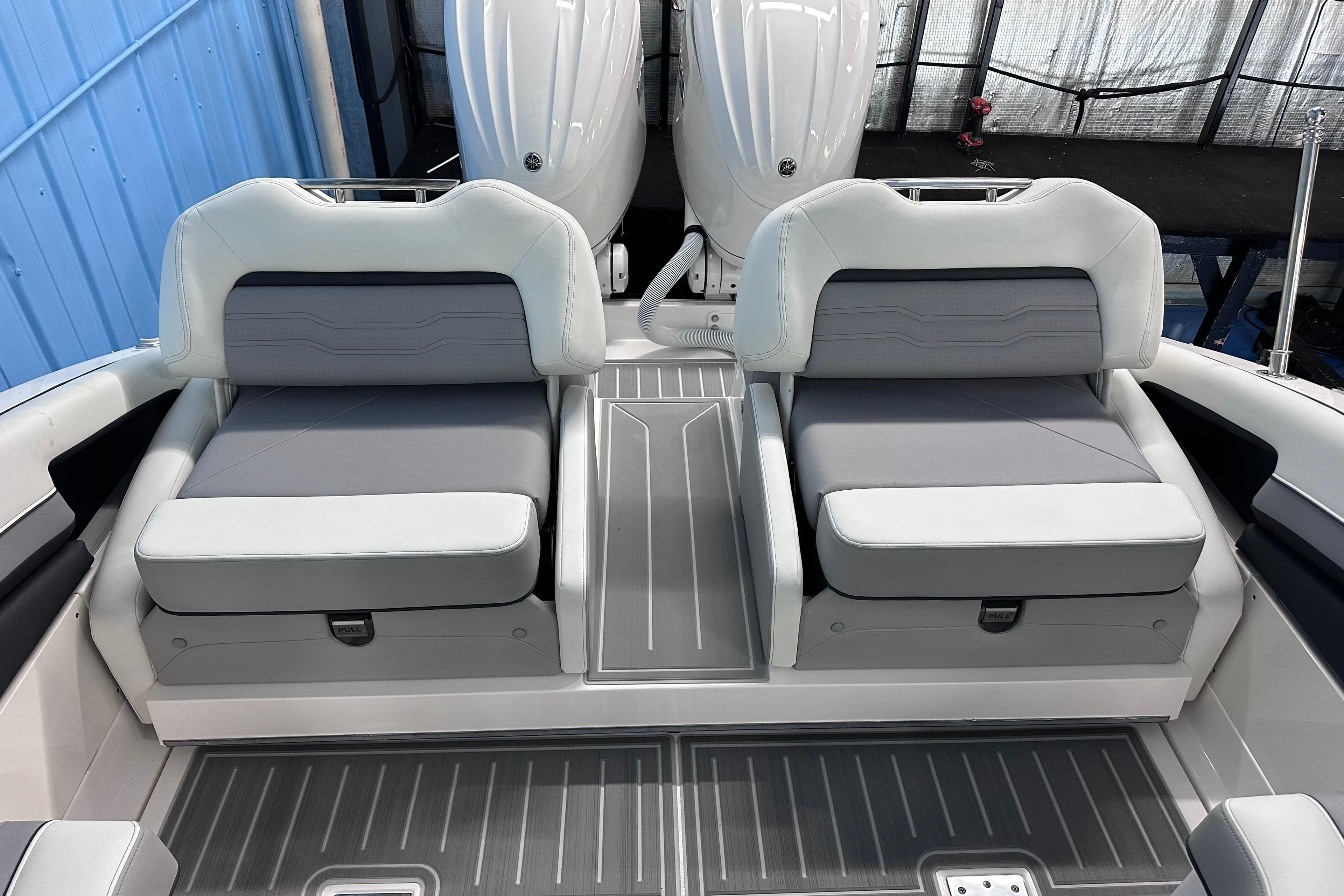 2026 Regal LX9 boat interior with dual gray and white cushioned seats.