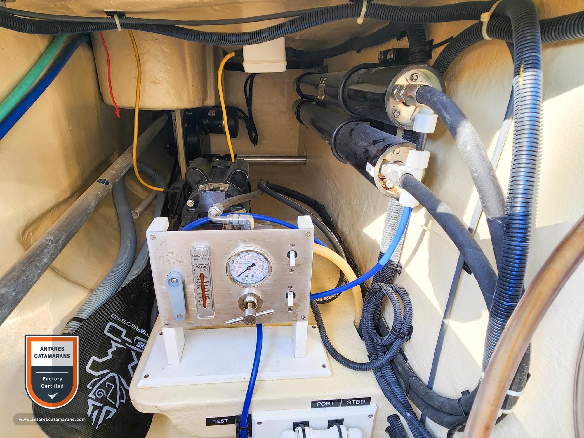 Engine compartment of a 2019 Antares 44 GT yacht, featuring mechanical components and wiring.