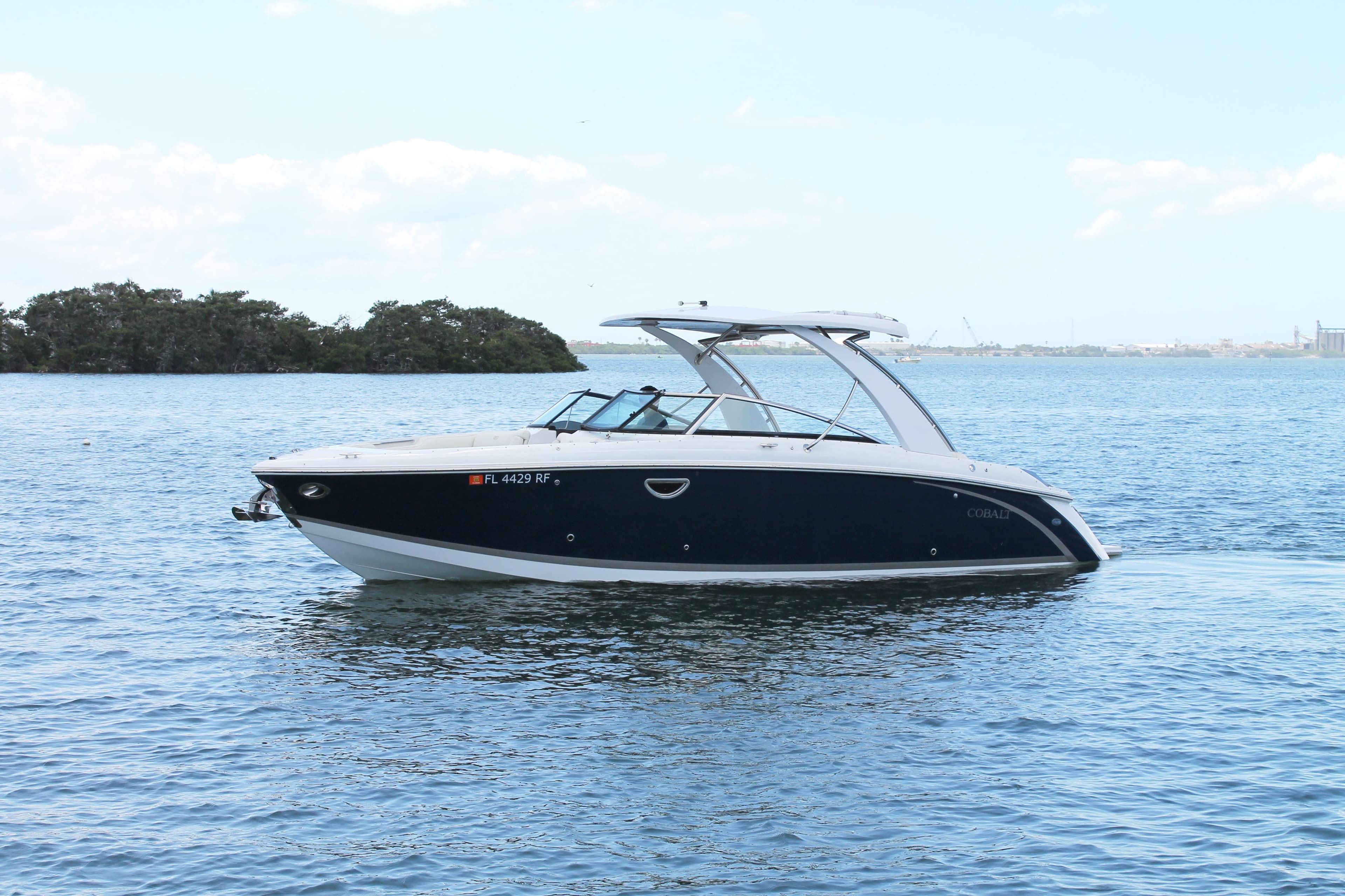2017 Cobalt R30 boat on calm water with distant shoreline.