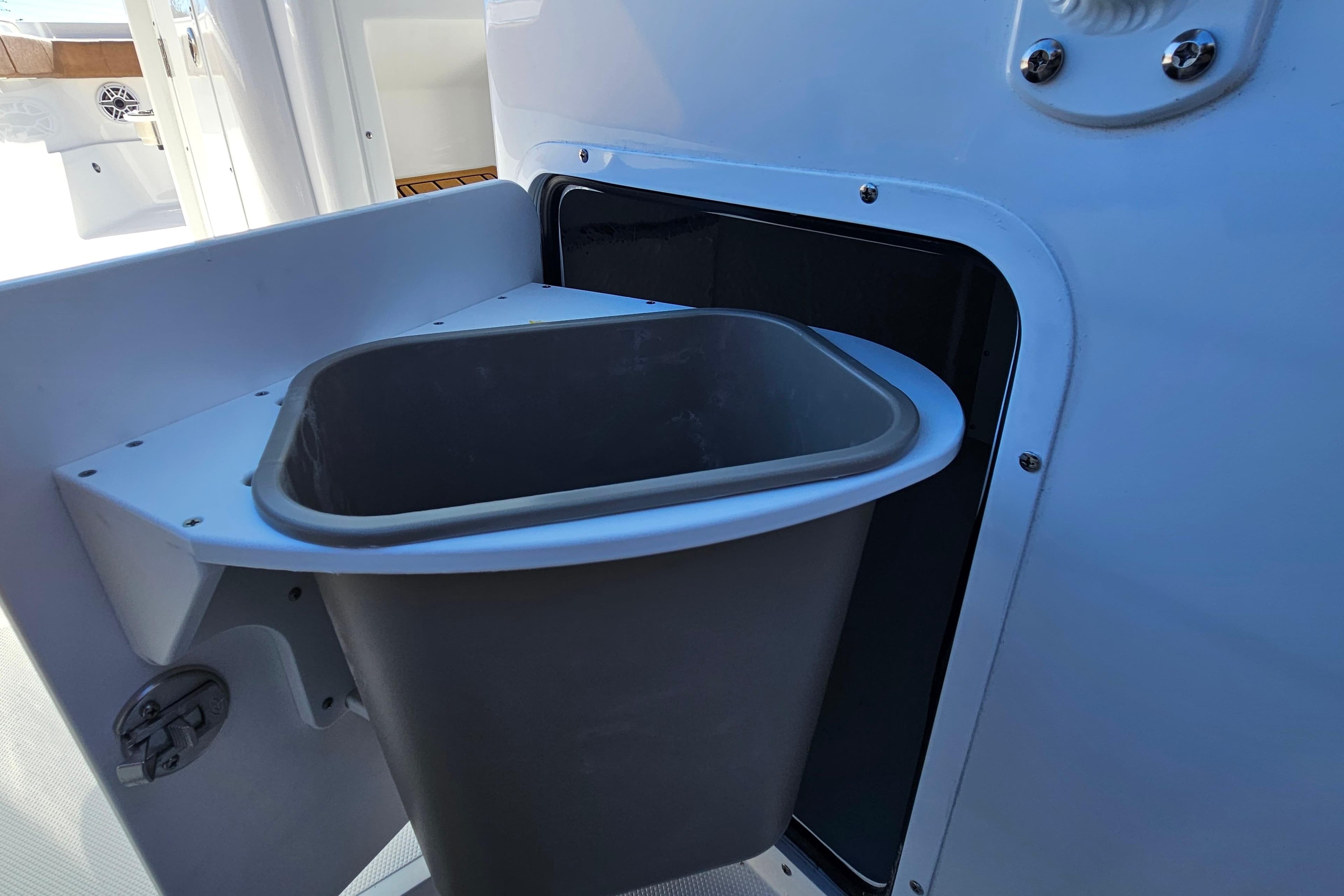 Built-in trash bin on 2026 Sea Hunt Ultra 275 Coffin Box boat.