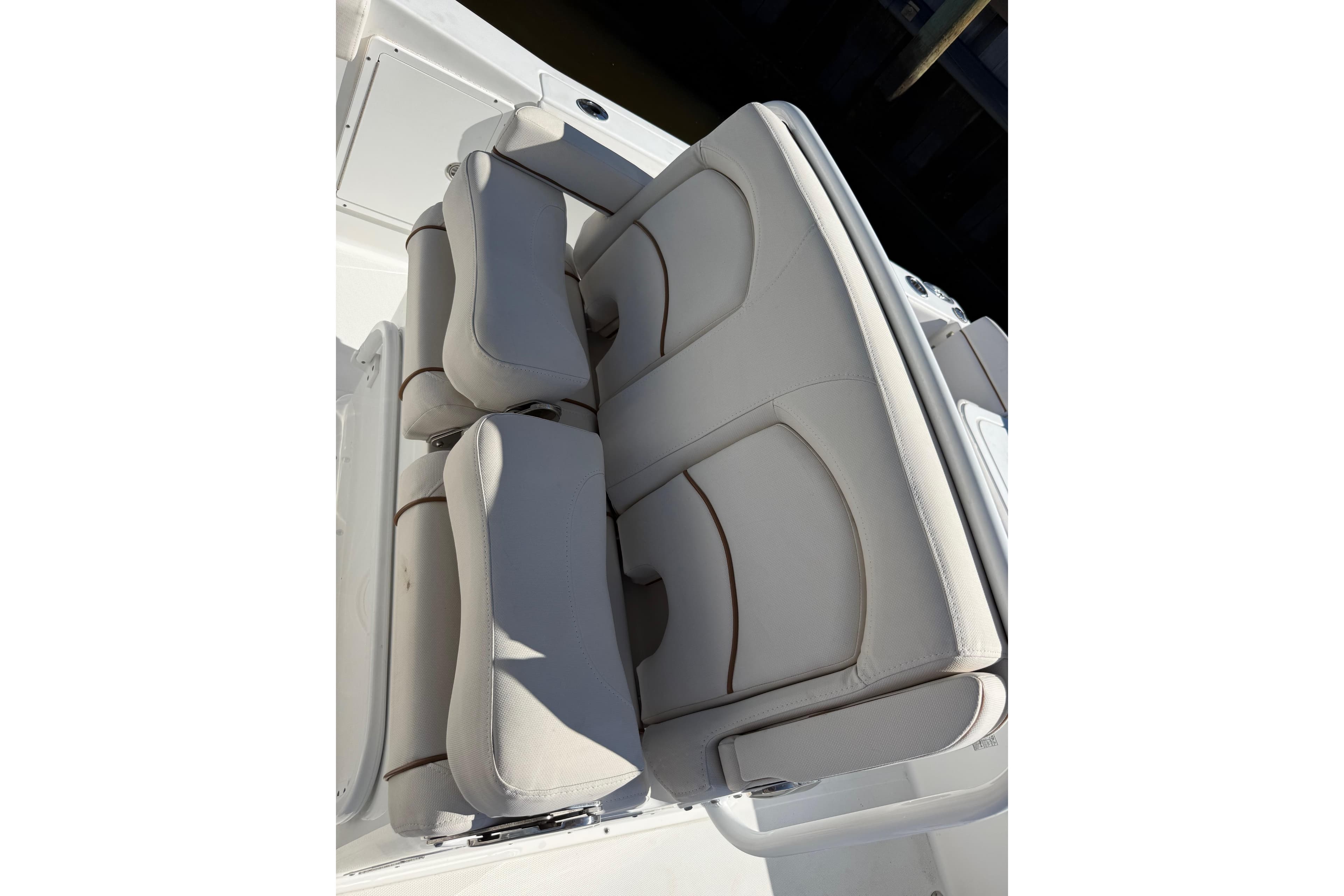 2020 Sea Hunt Gamefish 27 boat seating, featuring comfortable, cushioned design in light upholstery.