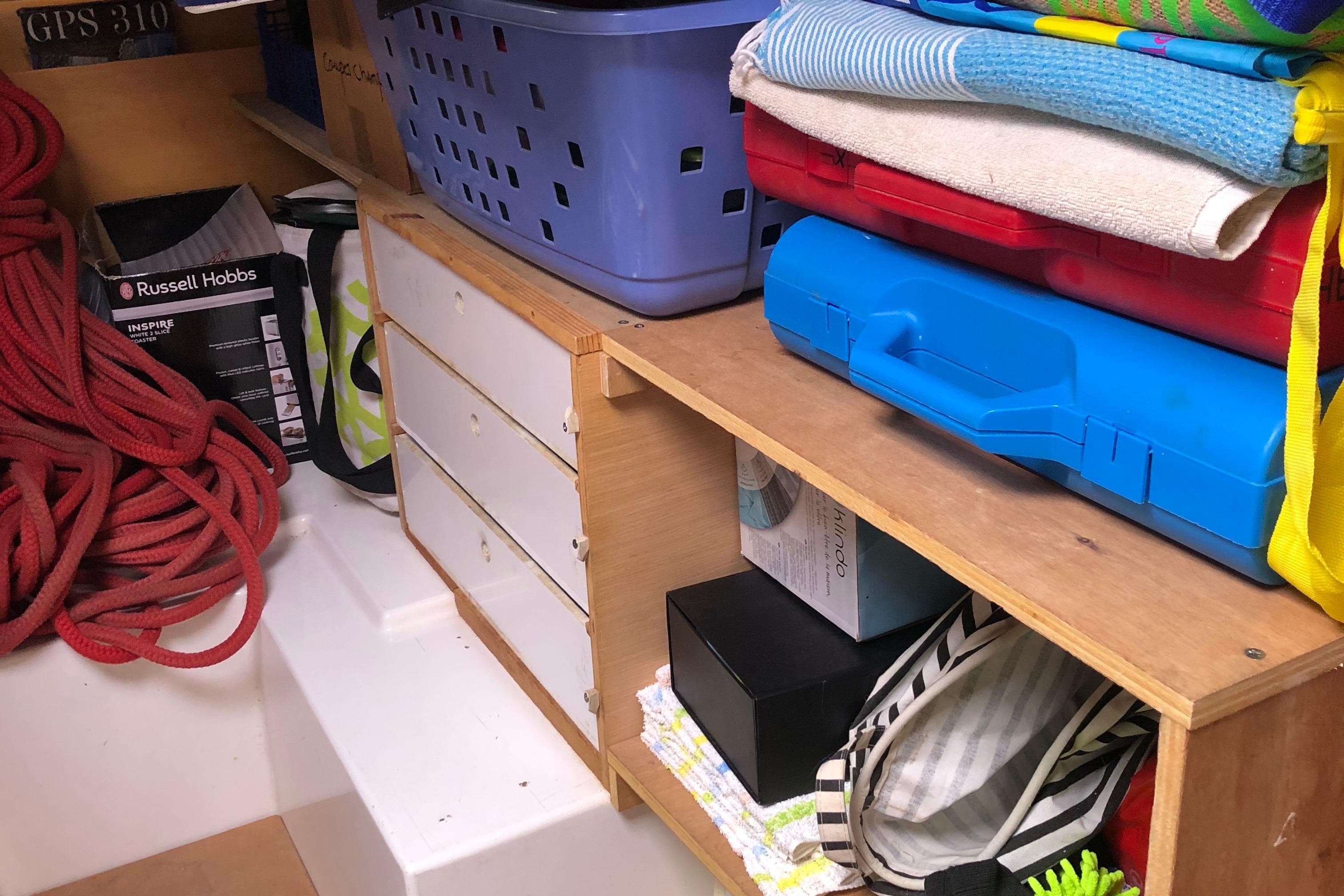 Storage area on a 2008 Fountaine Pajot Salina 48 catamaran with organized shelves and equipment.