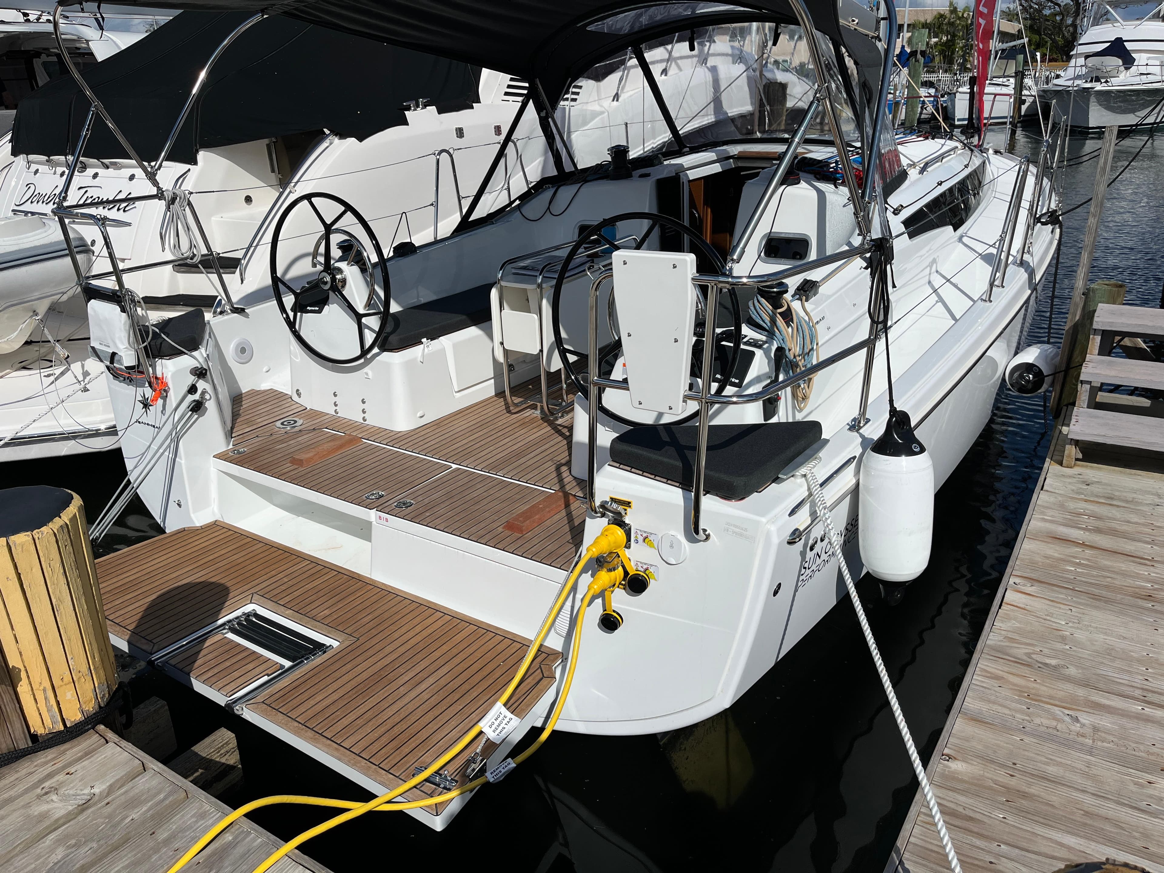 2025 Jeanneau Sun Odyssey 350 yacht docked, featuring spacious deck and modern design.