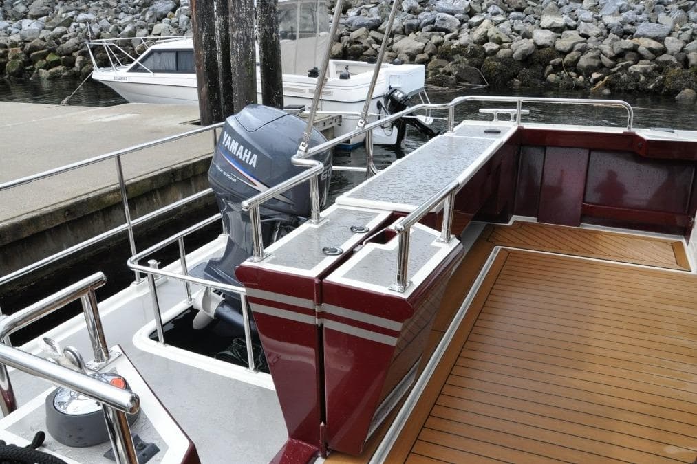2009 EagleCraft 47' Pilothouse boat with Yamaha outboard motor at dock.