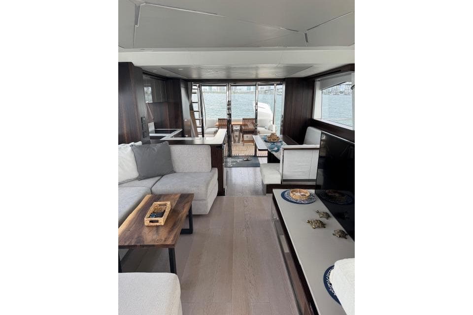 Luxurious interior of 2022 Sunseeker Manhattan 68 yacht with elegant seating and dining area.