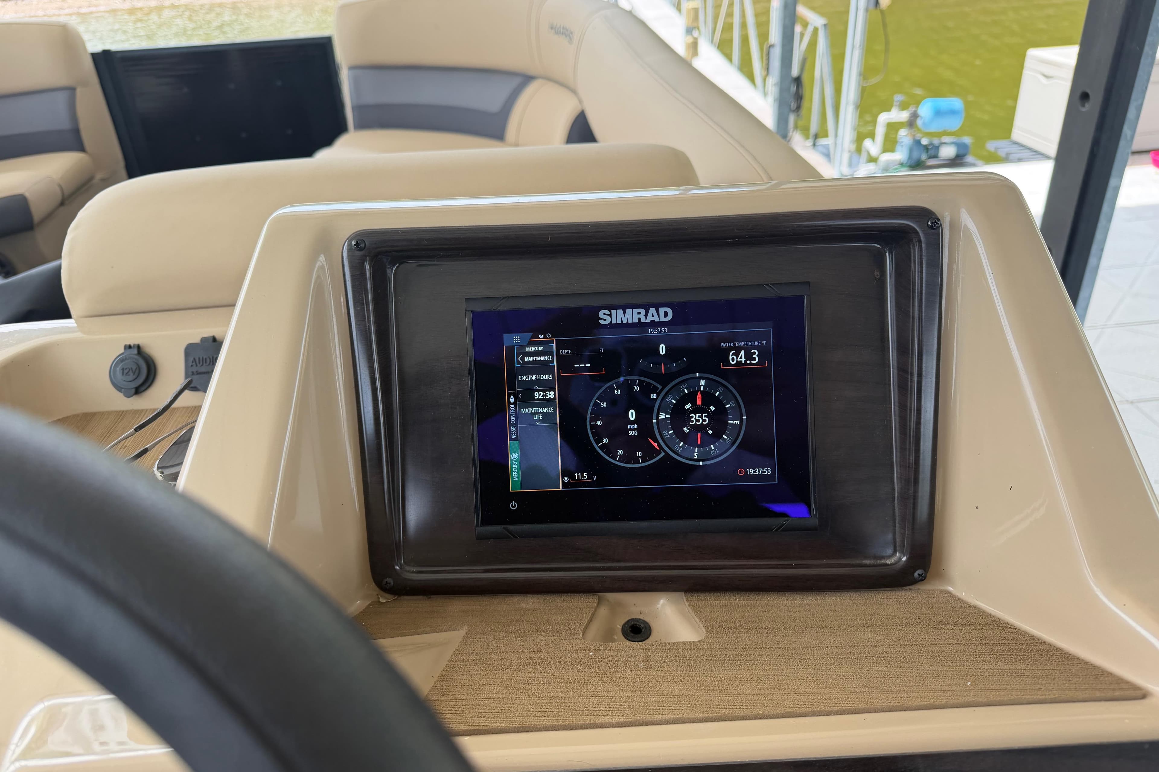 Simrad display on 2023 Harris Cruiser 250 CW boat dashboard, showing navigation data.