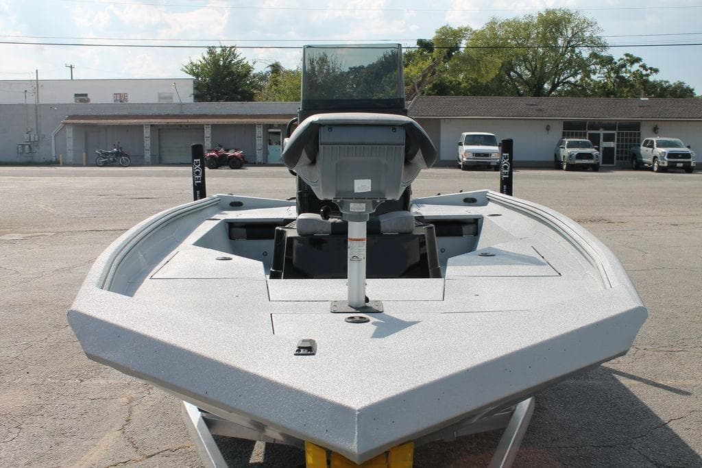 2026 Excel Bay Pro Elite 203 boat in a parking lot, front view.