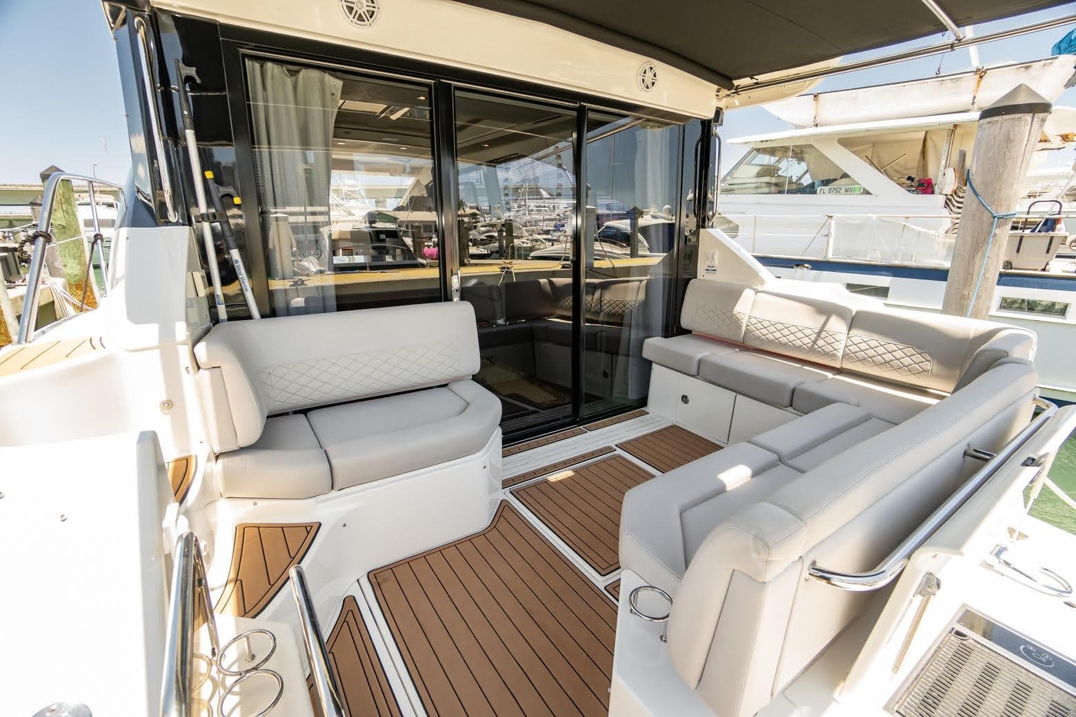Luxurious 2017 Sea Ray Sundancer 460 yacht with elegant seating and teak flooring.