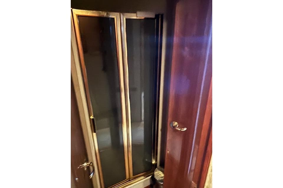 Wooden interior door on a 2007 Viking 52 Convertible yacht.