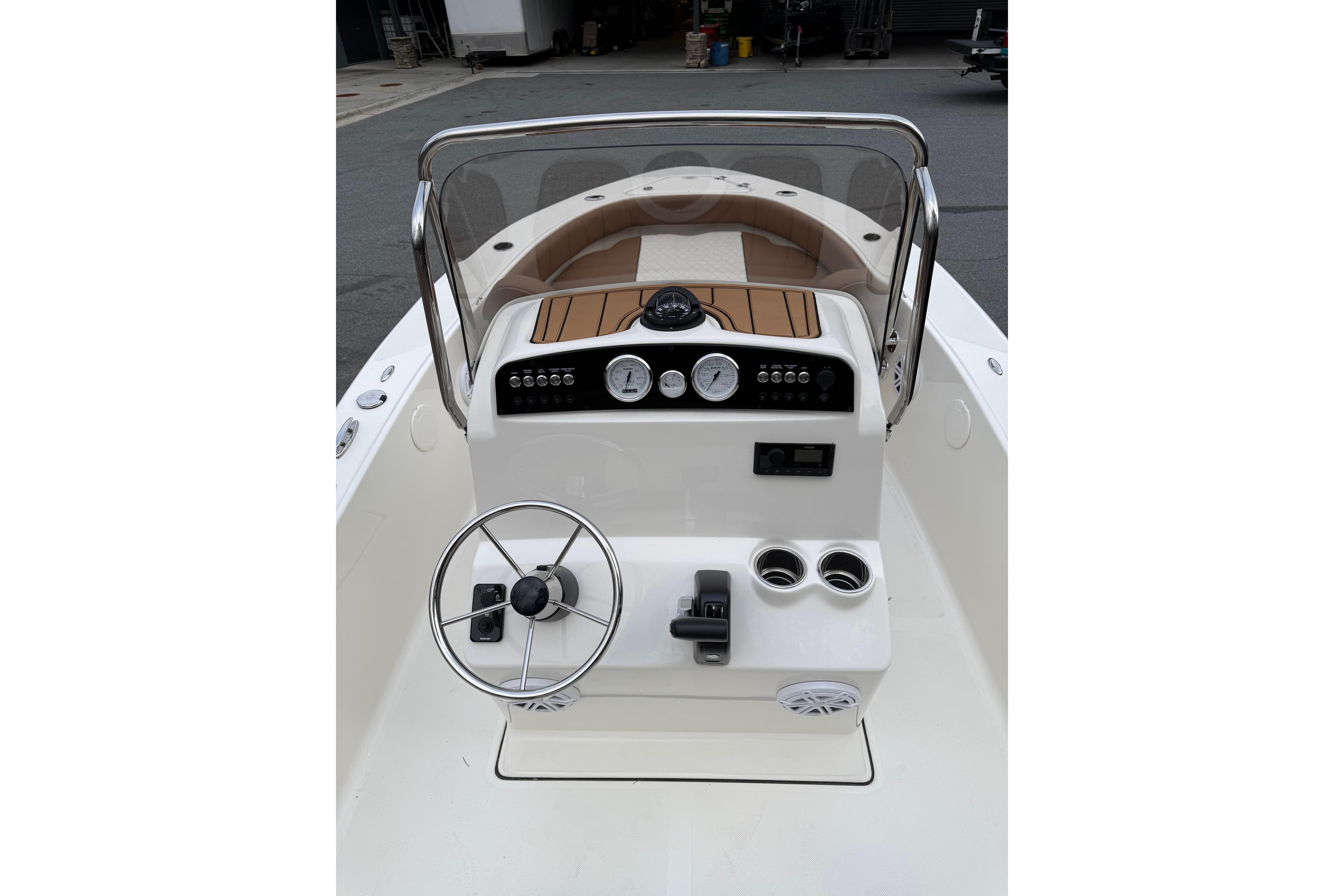 2026 Pioneer 180 Islander boat dashboard with steering wheel and controls.
