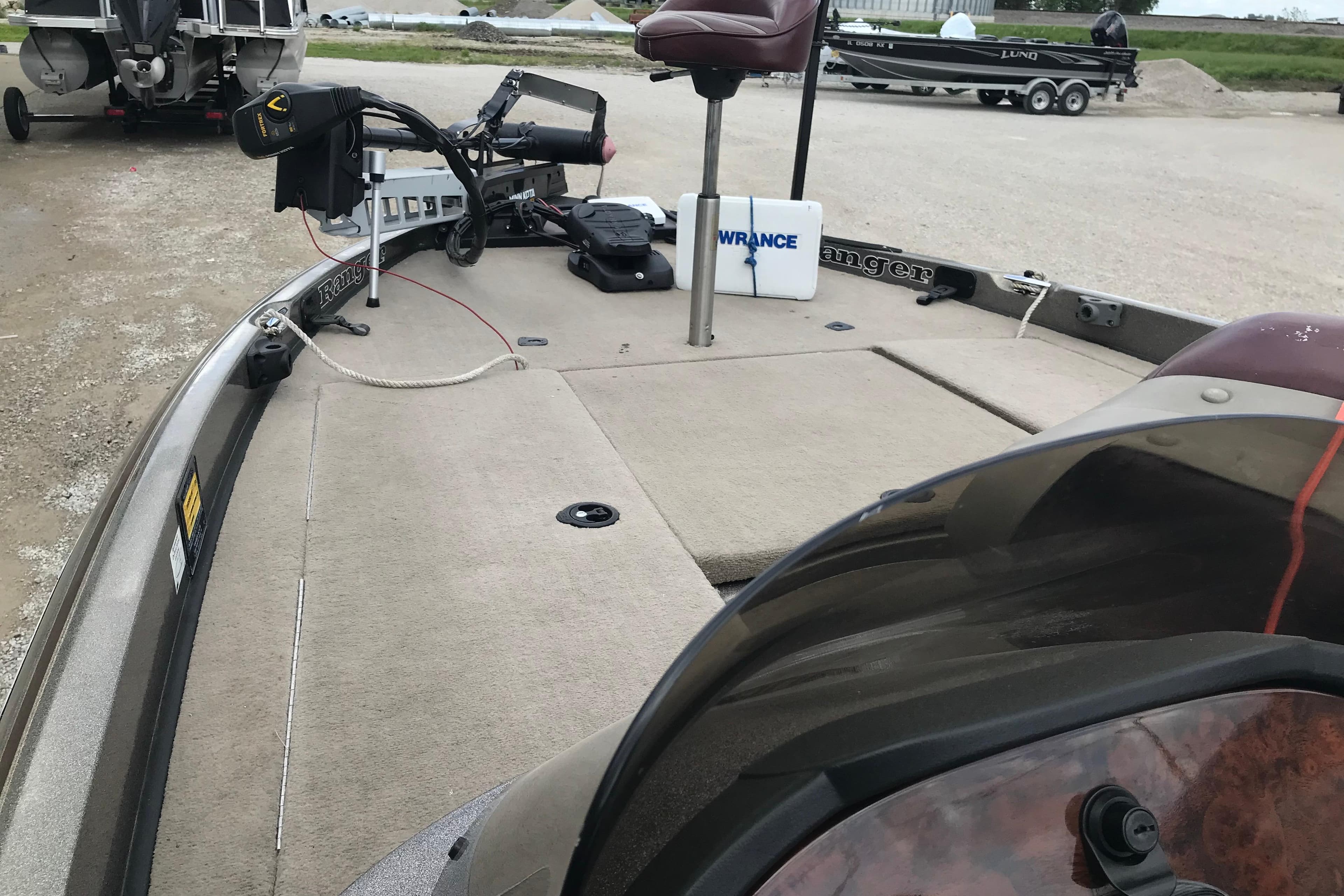2001 Ranger 518DVX Comanche boat with fishing equipment on deck.