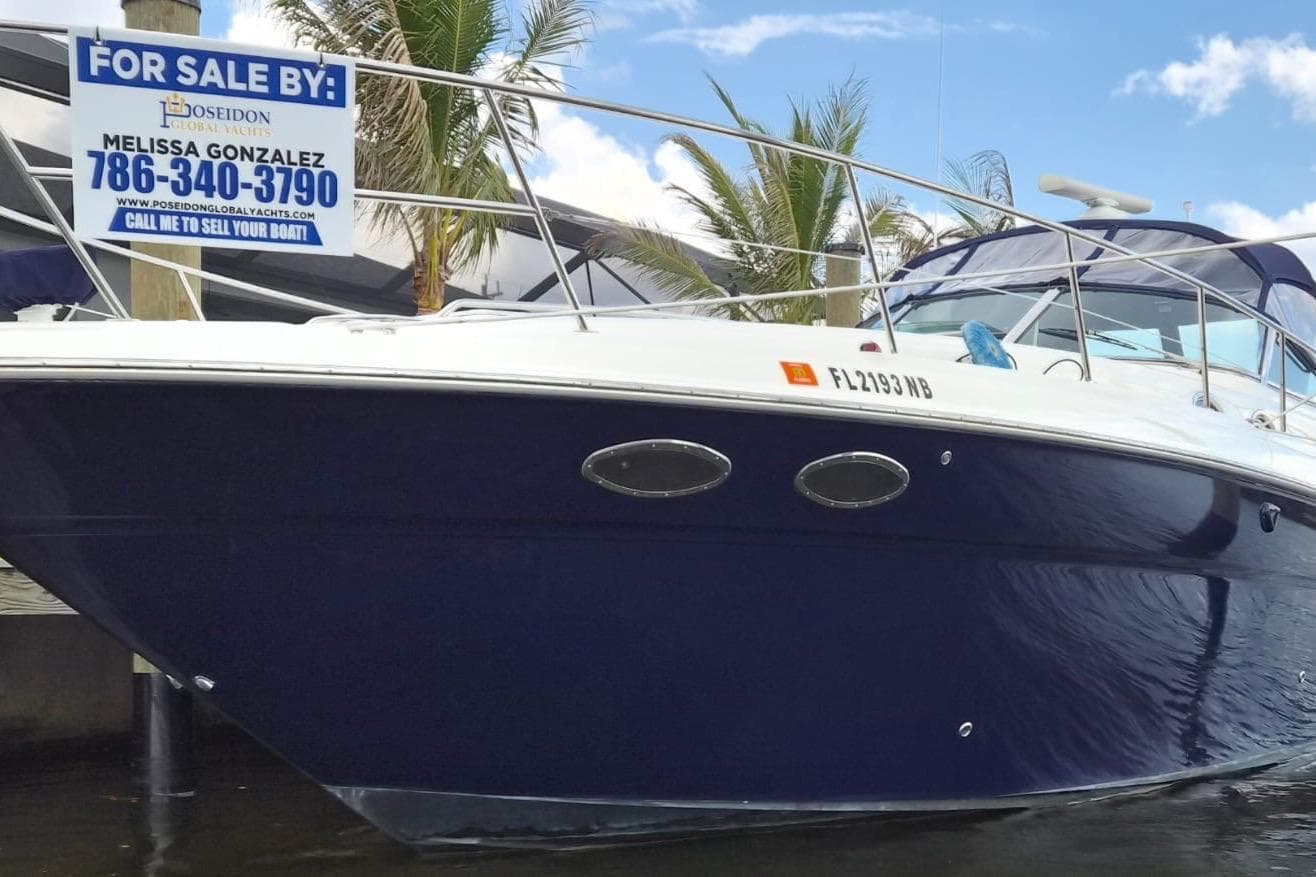 2004 Sea Ray 380 Sundancer yacht for sale, docked with contact information displayed.