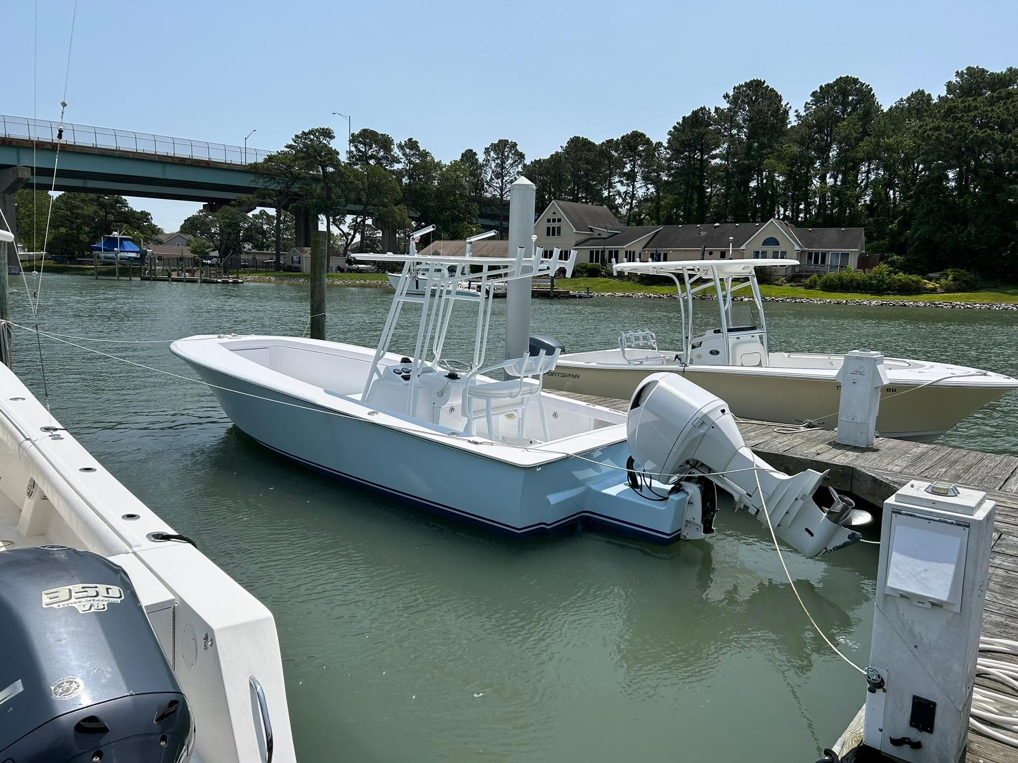 2019 Albemarle CAPPS Custom Center Console boat docked in a serene marina.