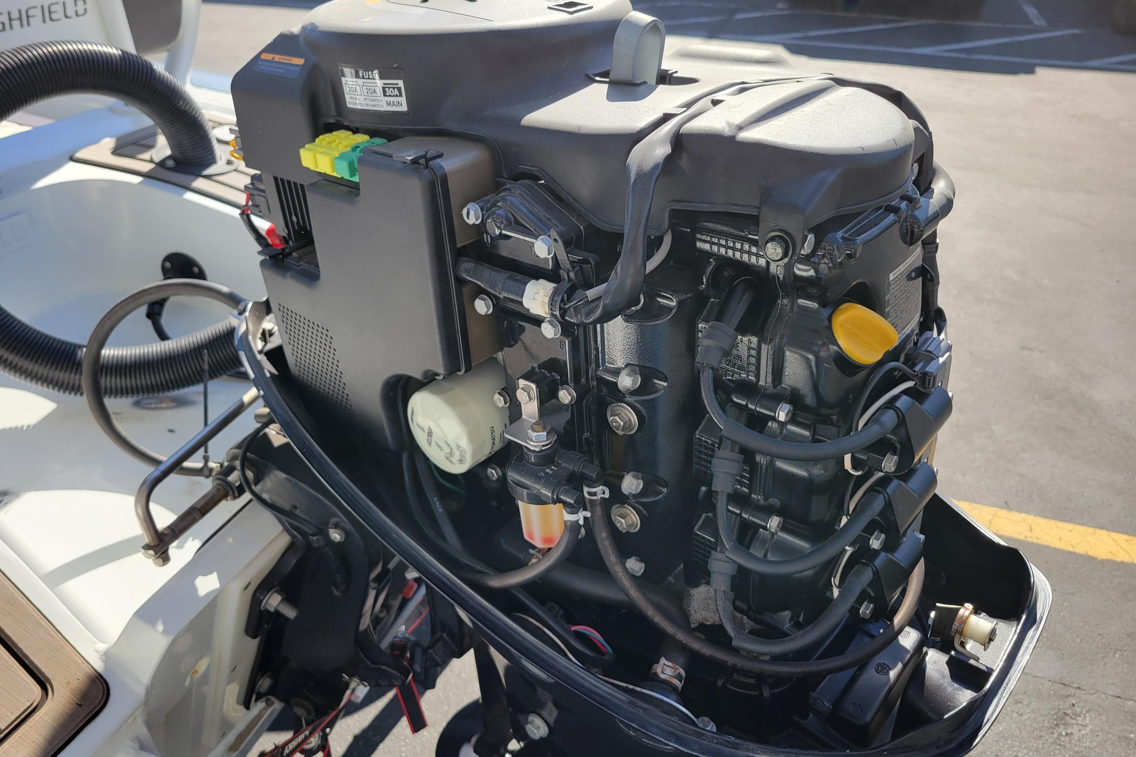 Outboard motor of a 2022 Highfield Sport 460 boat, detailed view.