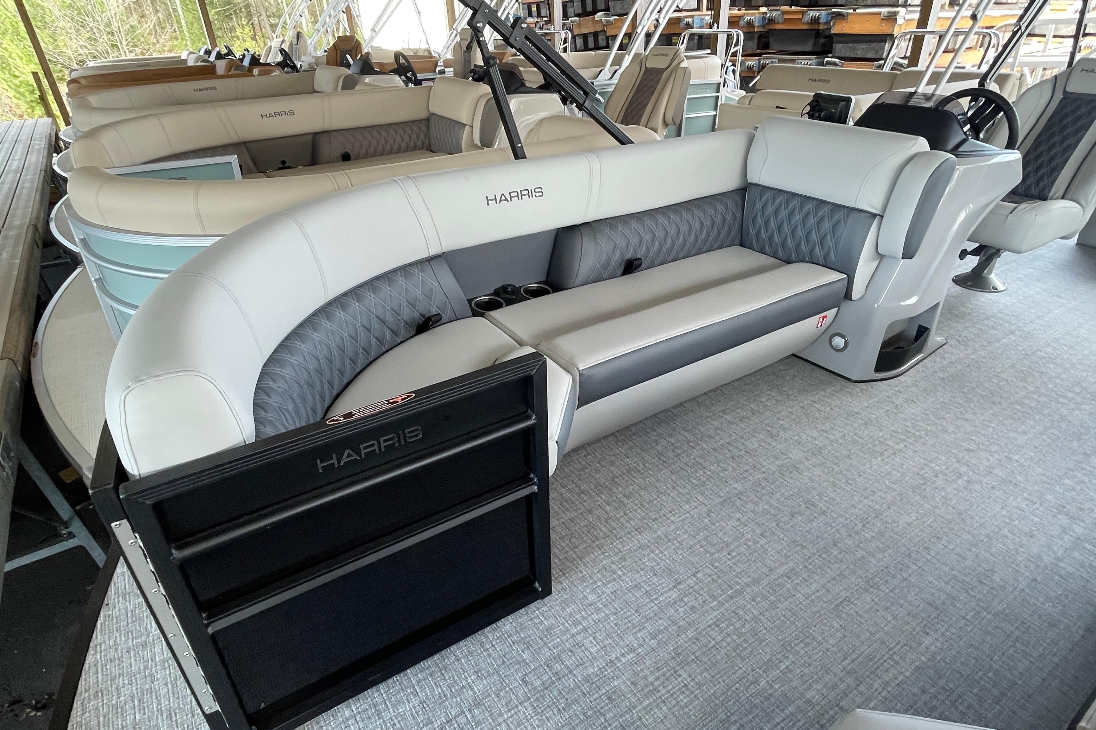 2026 Harris Cruiser 230 pontoon boat with luxurious seating and modern design.