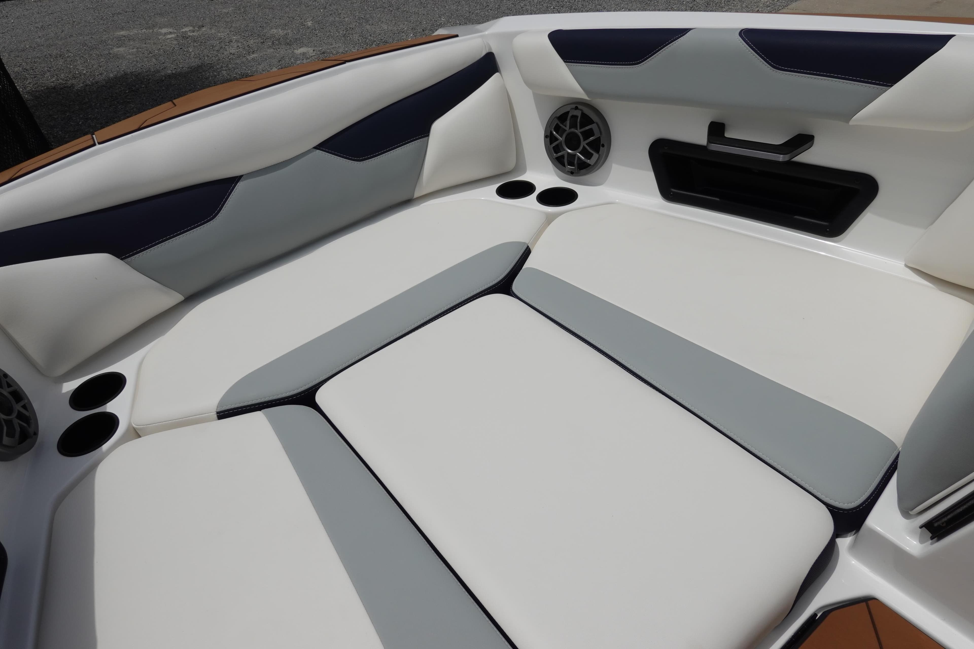 2023 Axis A24 boat interior with cushioned seating and built-in speakers.