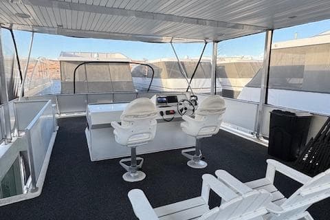 2015 Bravada Intrepid Share #10 houseboat with spacious upper deck and modern helm.