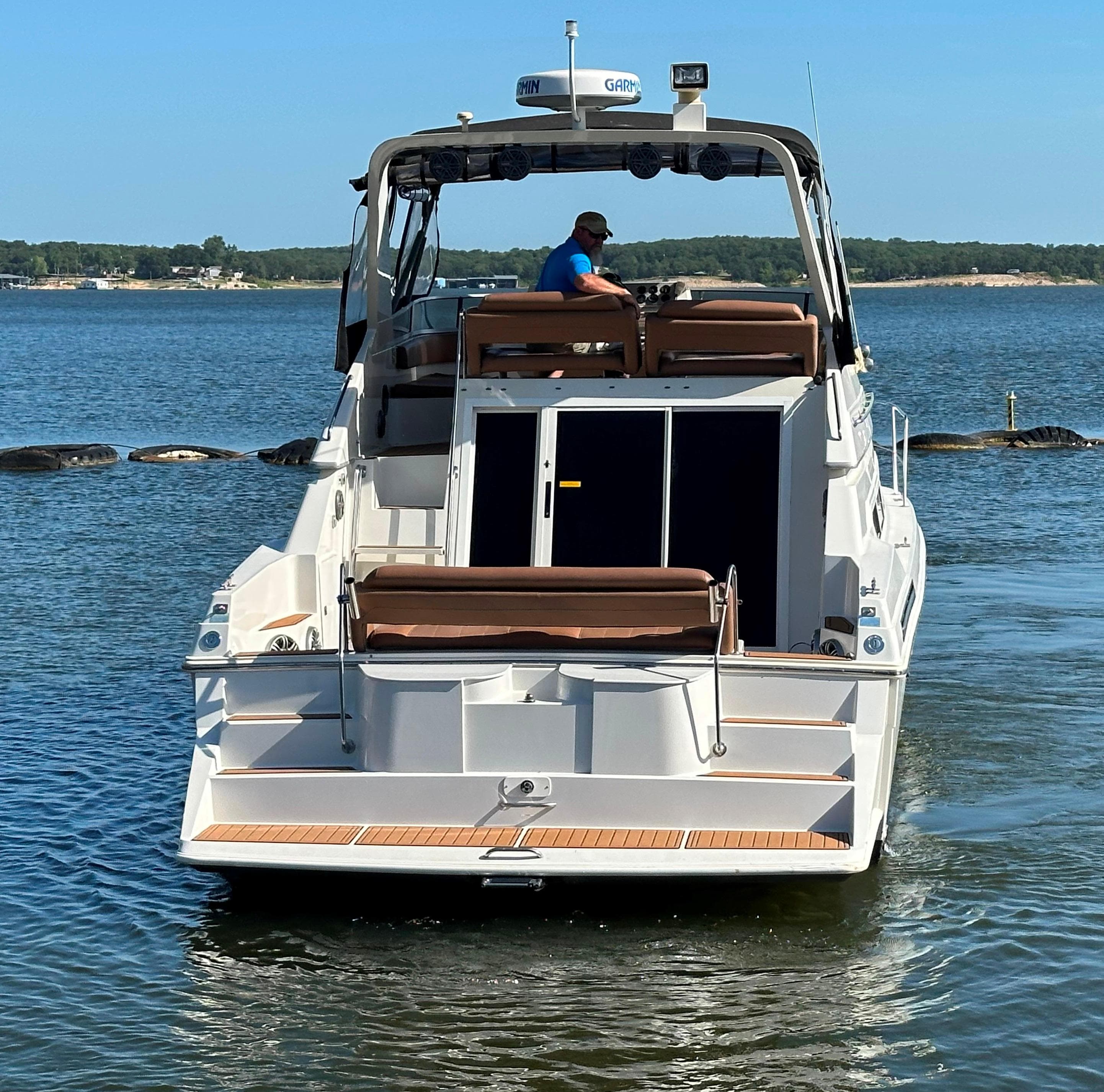 1996 Carver 38 Santego yacht on calm water, rear view.