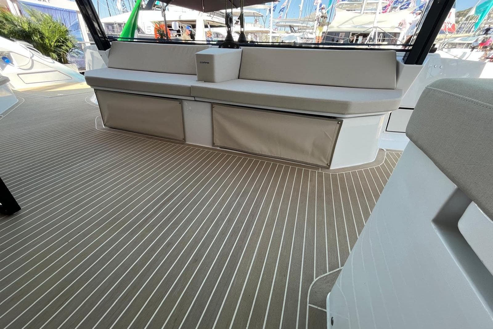 Luxurious seating area on 2026 Comar C-CAT 65 yacht with sleek deck design.
