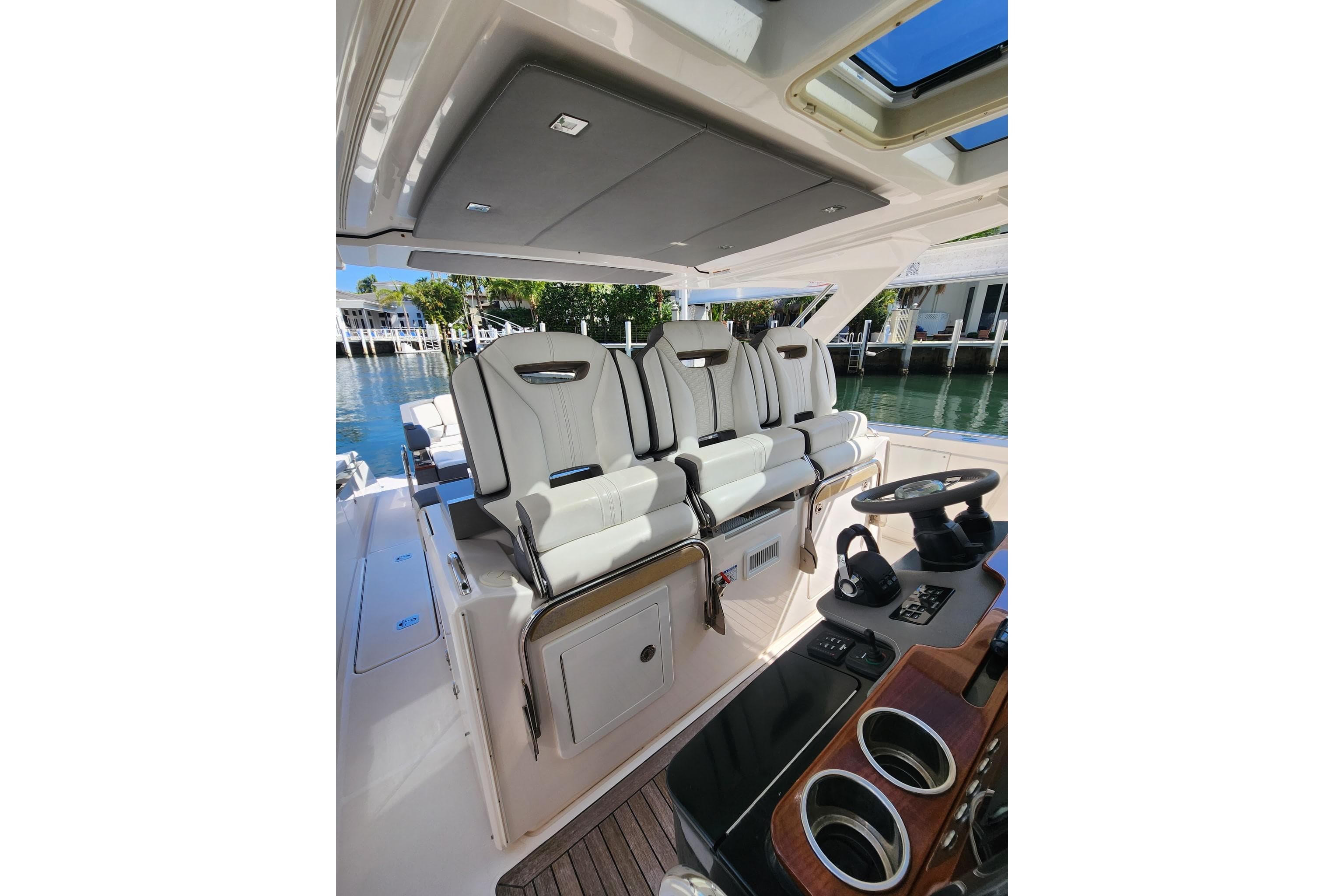 2019 Tiara Sport 38 LS boat interior with luxurious seating and modern helm controls.