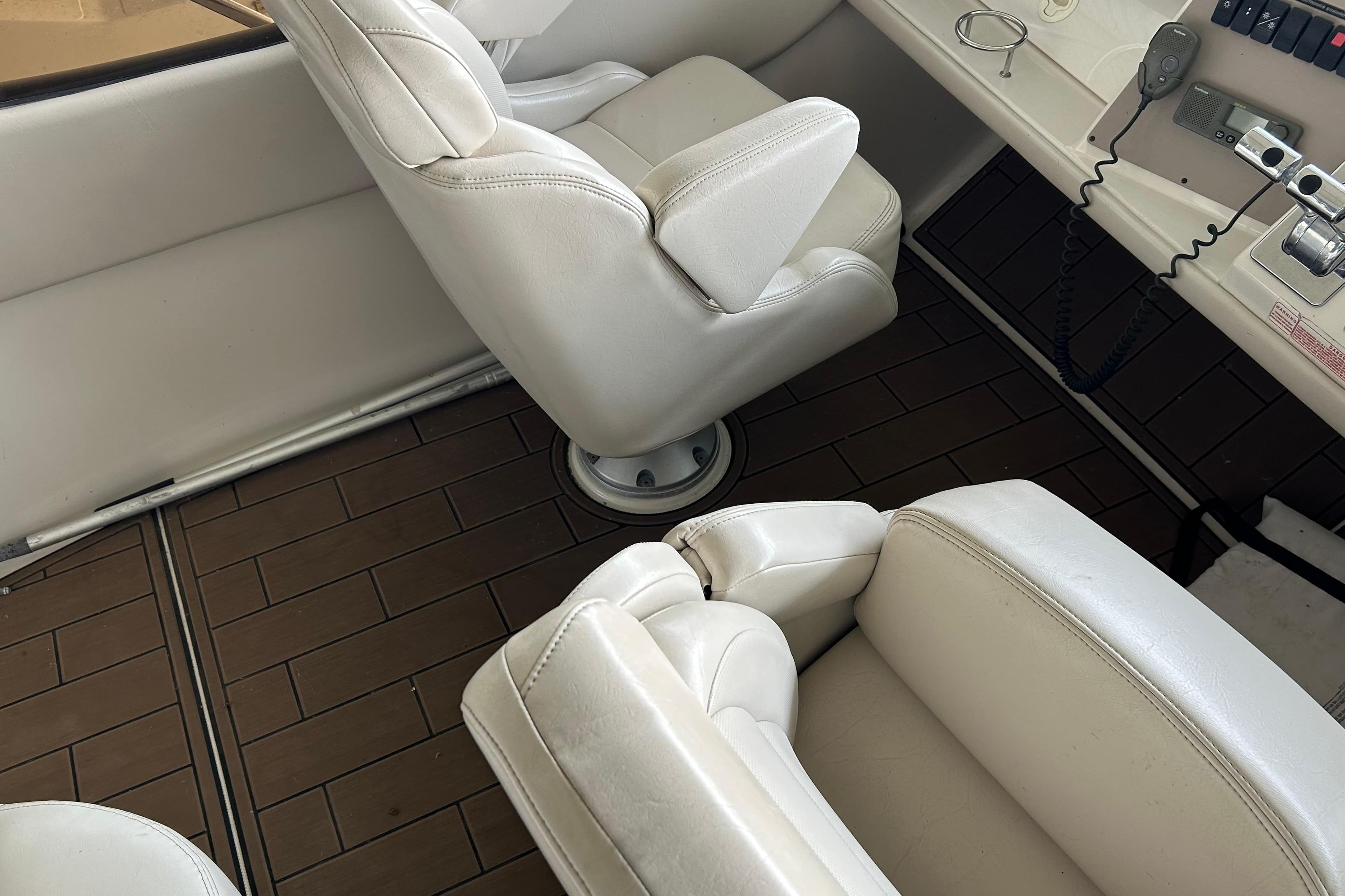 White leather seats in a 2001 Regal Commodore 3880 boat interior.
