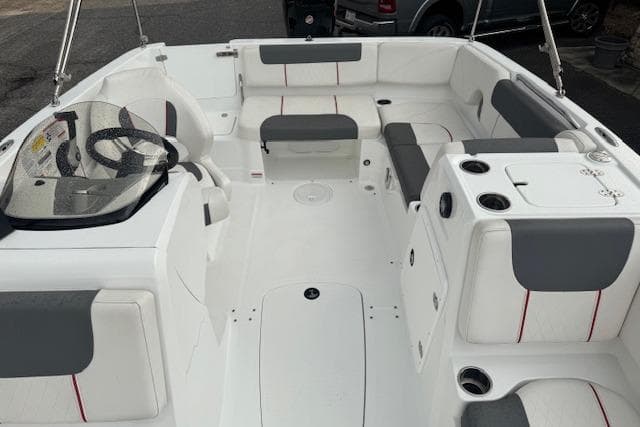Interior of a 2018 Tahoe 1950 boat with white and gray seating.