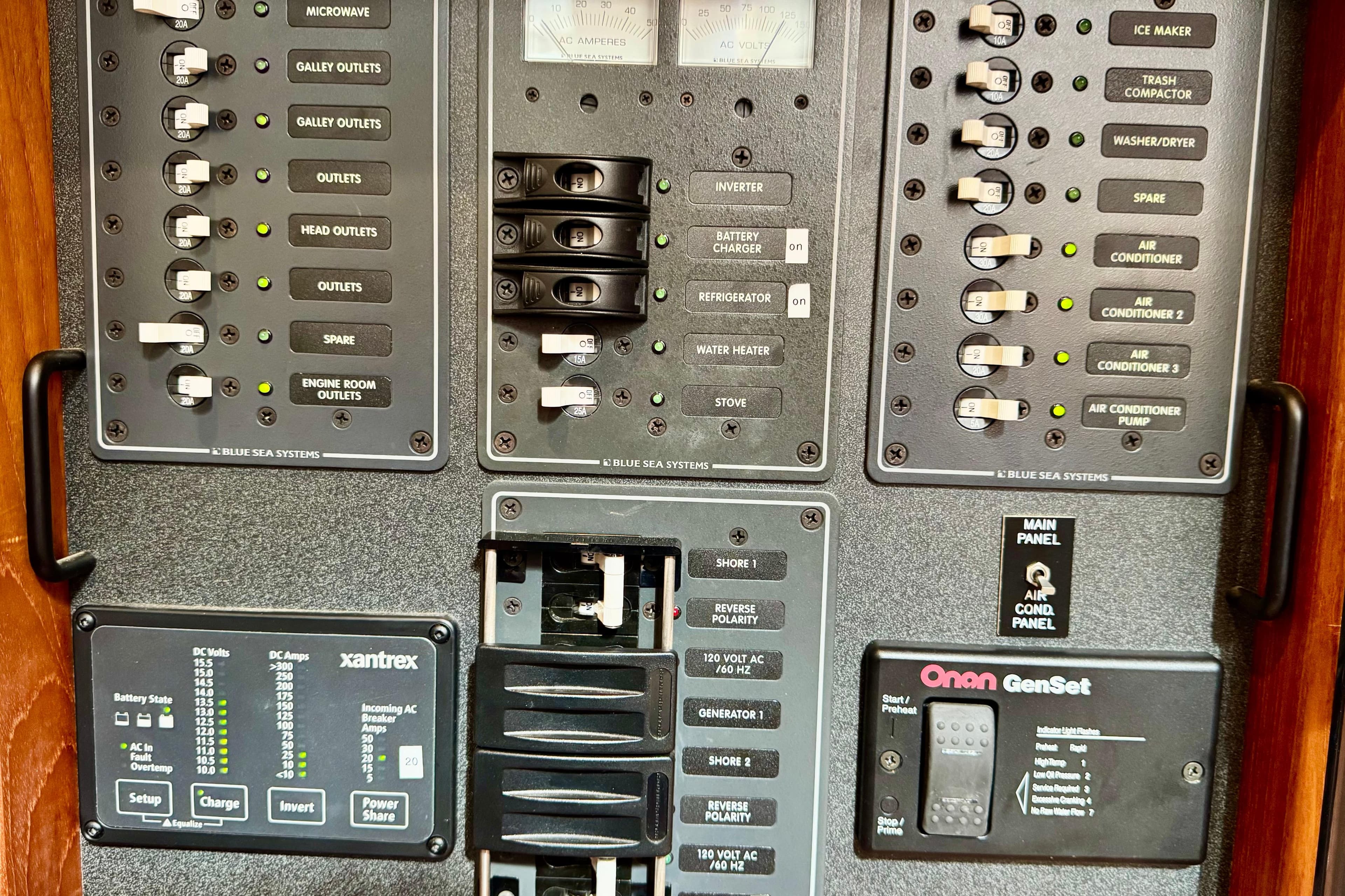 Electrical control panel on a 2004 Nordic Tug 42 boat, featuring various switches and indicators.
