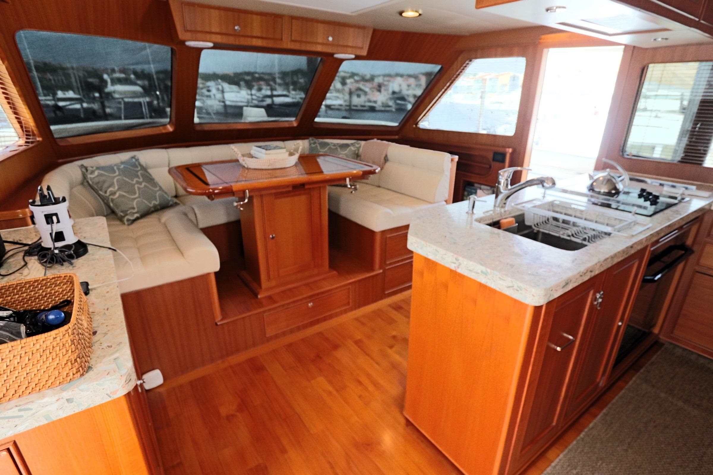 Luxurious interior of 2017 Marlow Explorer 49E yacht with kitchen and seating area.