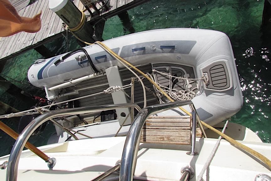 Overhead view of a 1992 Hatteras 40 Motor Yacht with an inflatable boat docked.