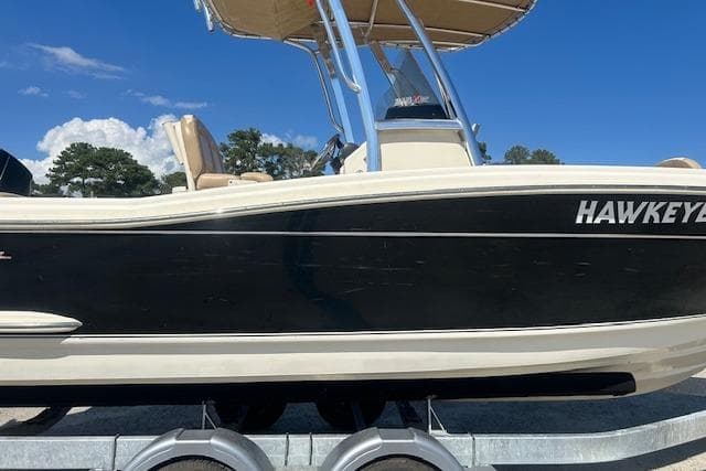 2022 Scout 215 XSF boat on trailer under clear blue sky.