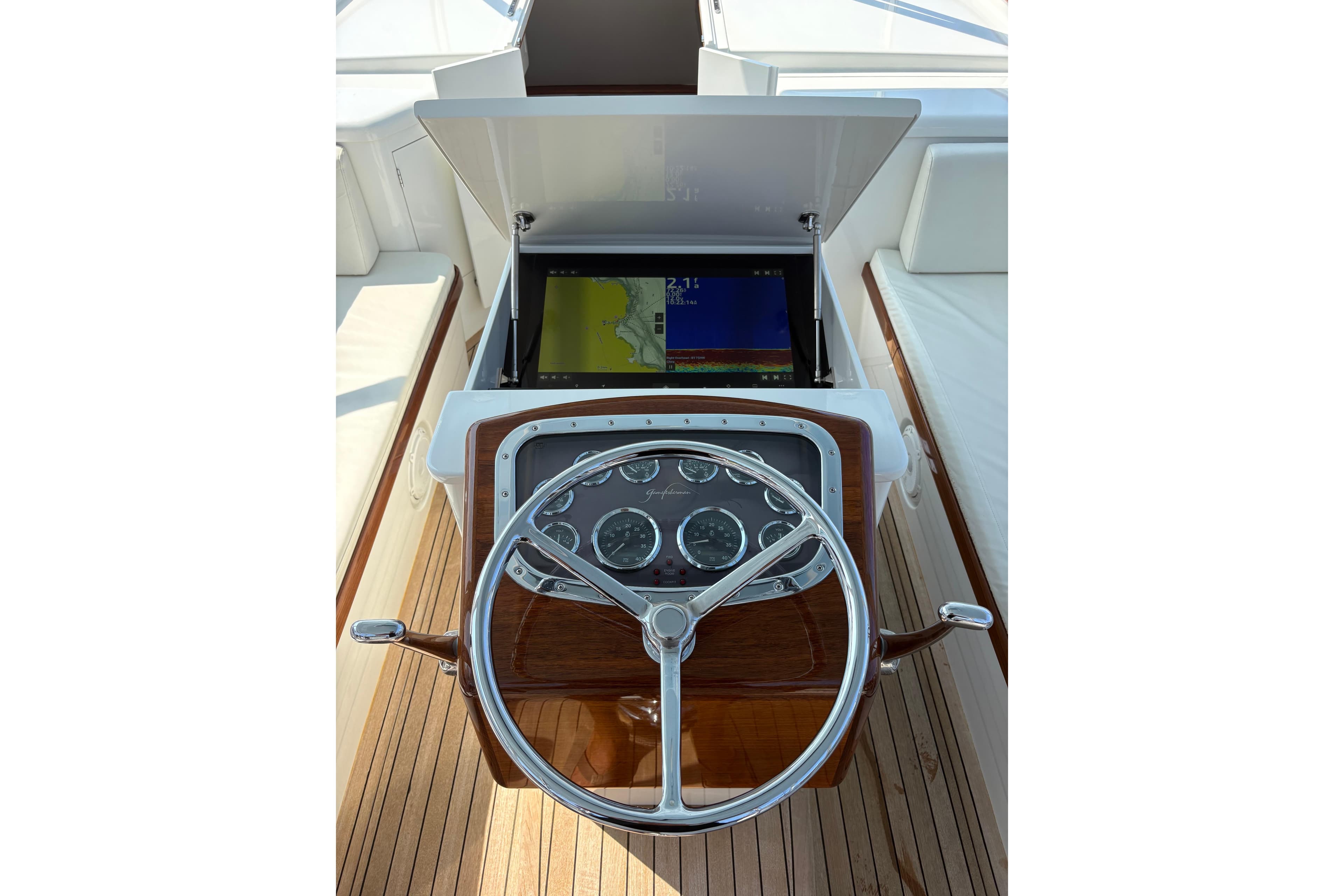 2007 Gamefisherman 42 Walkaround helm with navigation display and classic steering wheel.