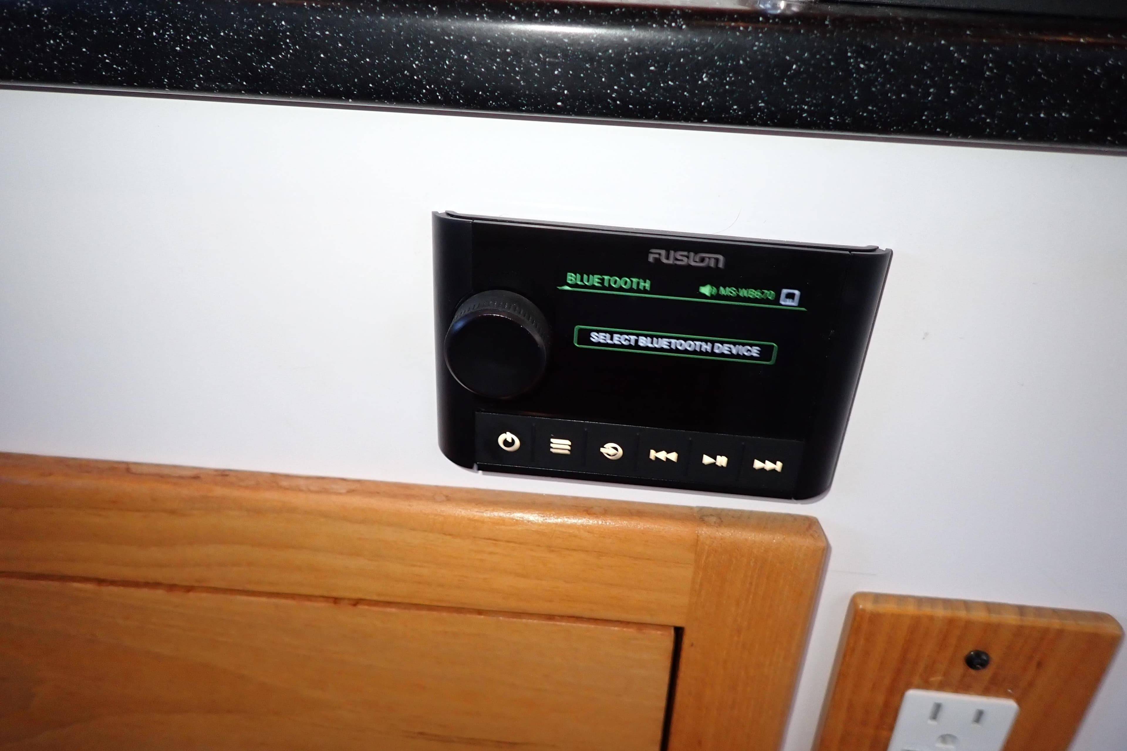 Control panel on 2023 True North 34 Outboard Express, featuring Bluetooth connectivity options.