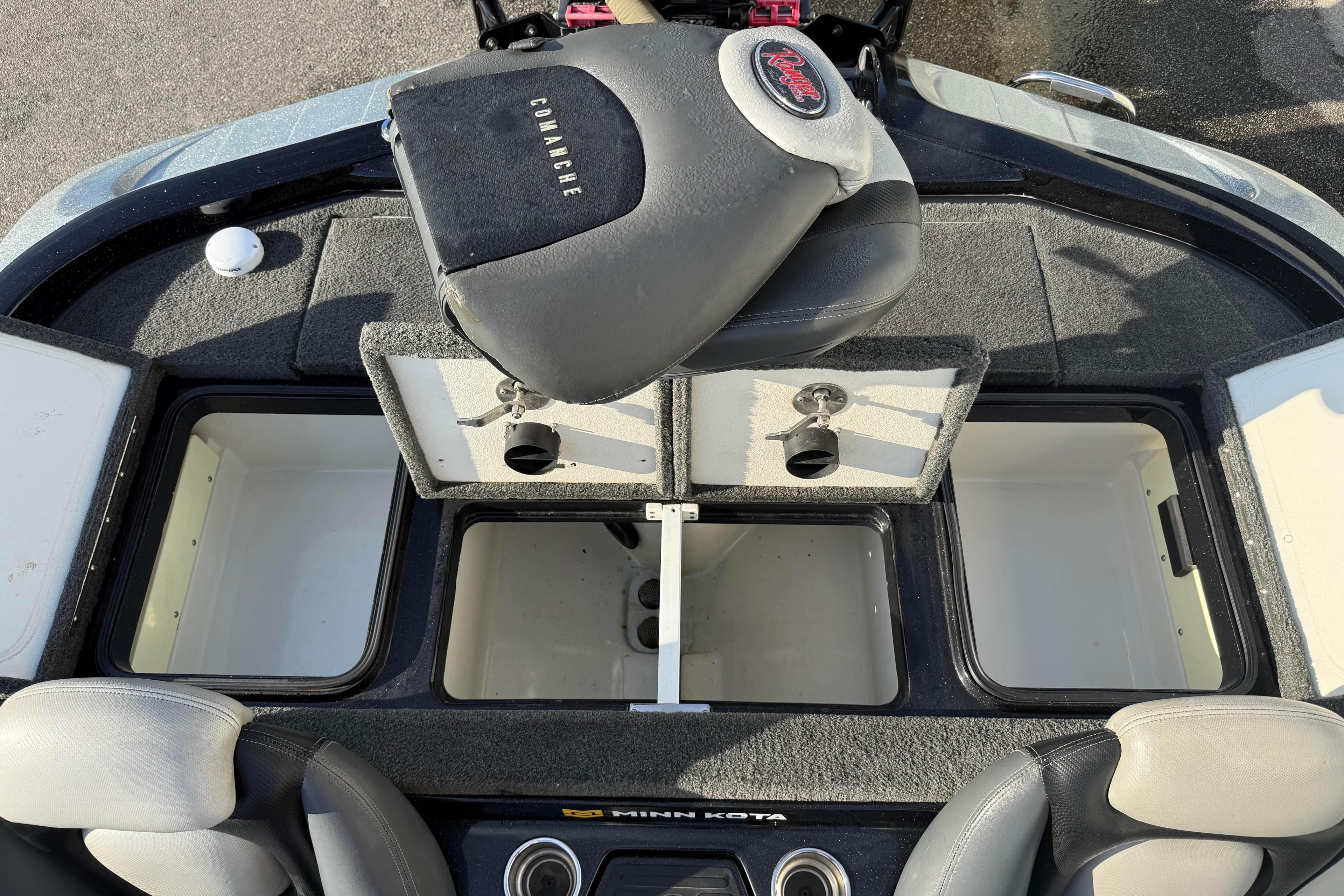 2015 Ranger Z118 Comanche boat interior with open storage compartments and seating.