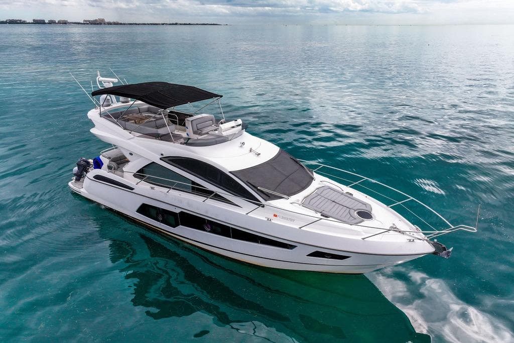 2016 Sunseeker Manhattan 55 yacht cruising on calm blue waters.