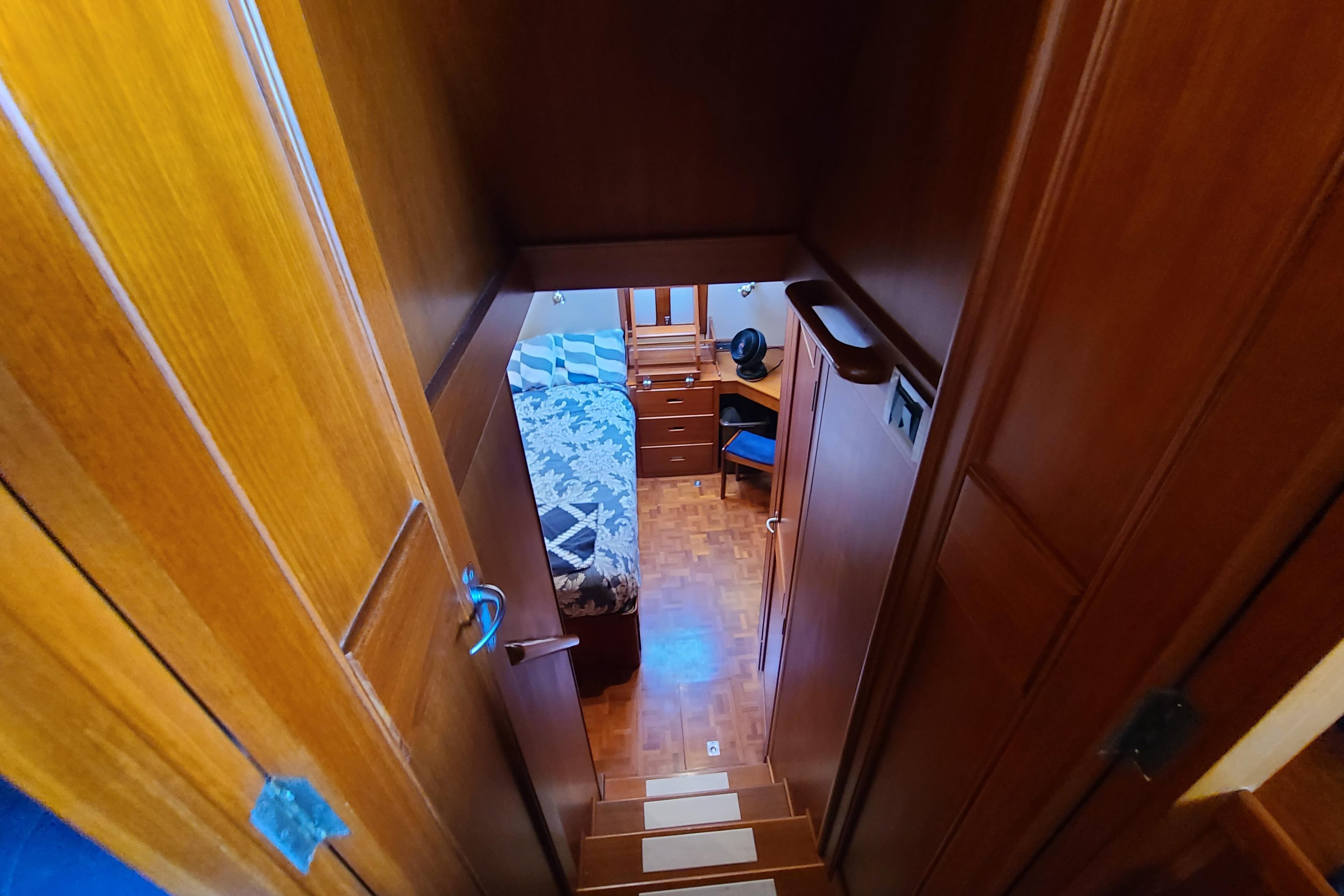 Interior view of 2000 Grand Banks 46 Classic yacht cabin with wooden finish.