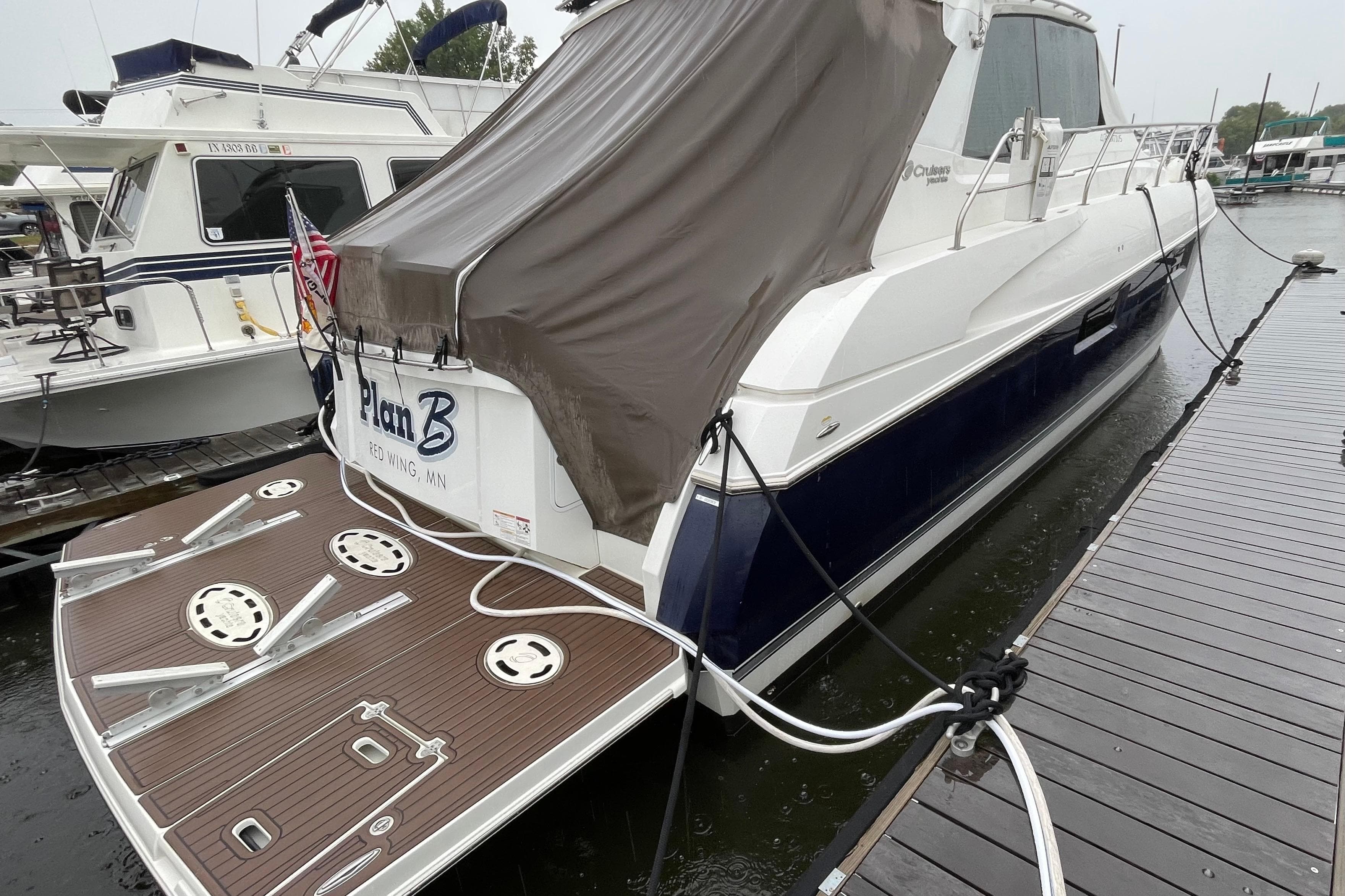 2012 Cruisers Yachts 48 Cantius docked, rear view with covered deck, Red Wing, MN.