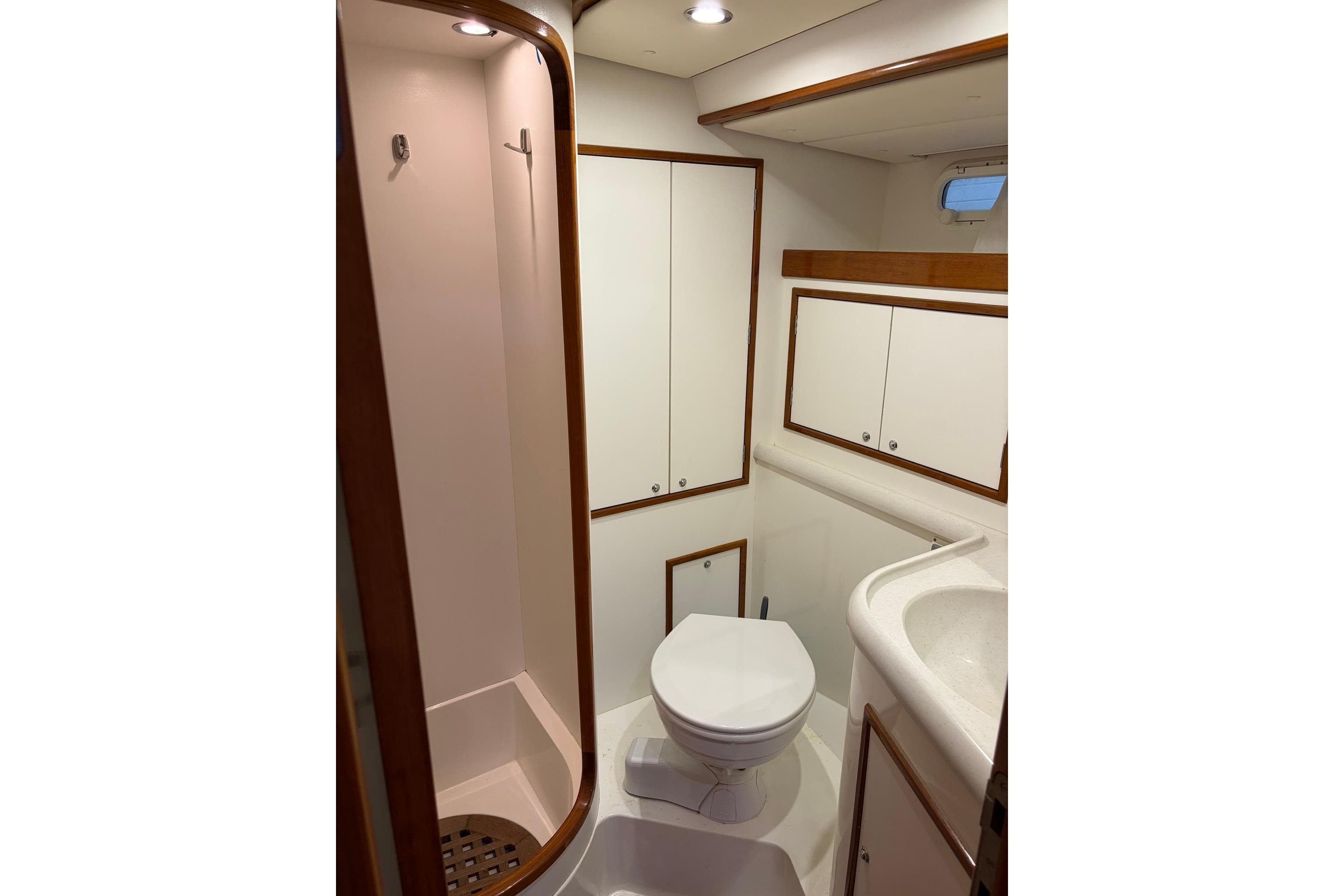 Bathroom interior of 2006 Contest 50CS yacht with shower, toilet, and sink.